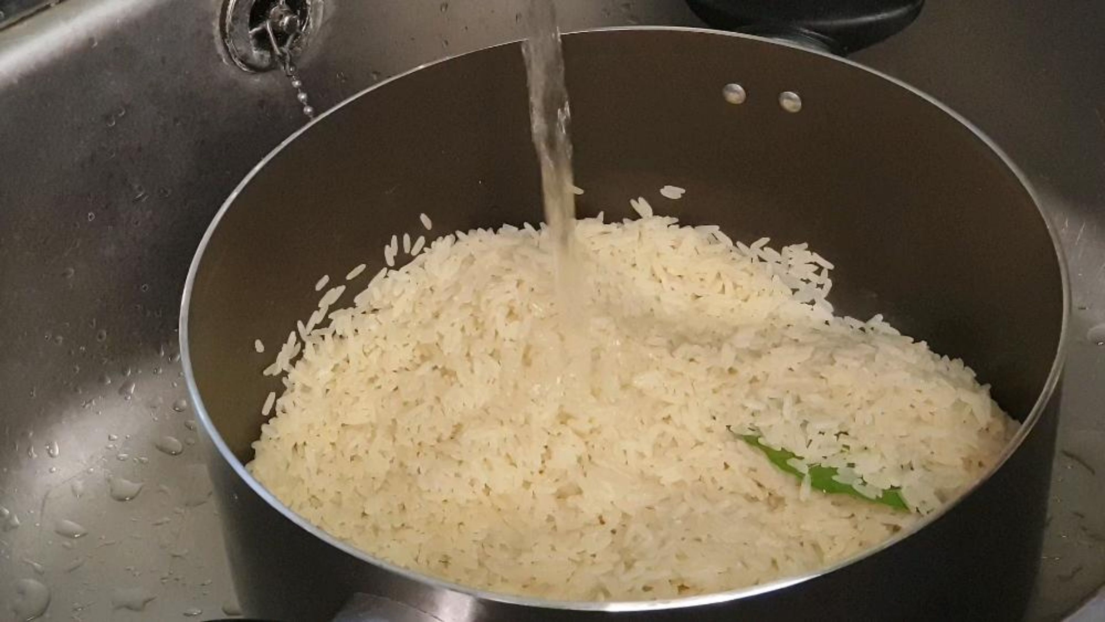 Rinse par boiled rice under cold water for 2 minutes to stop cooking process and then strain. Allow rice to sit in the strainer for a further 2 minutes allowing the excess water to be drained.