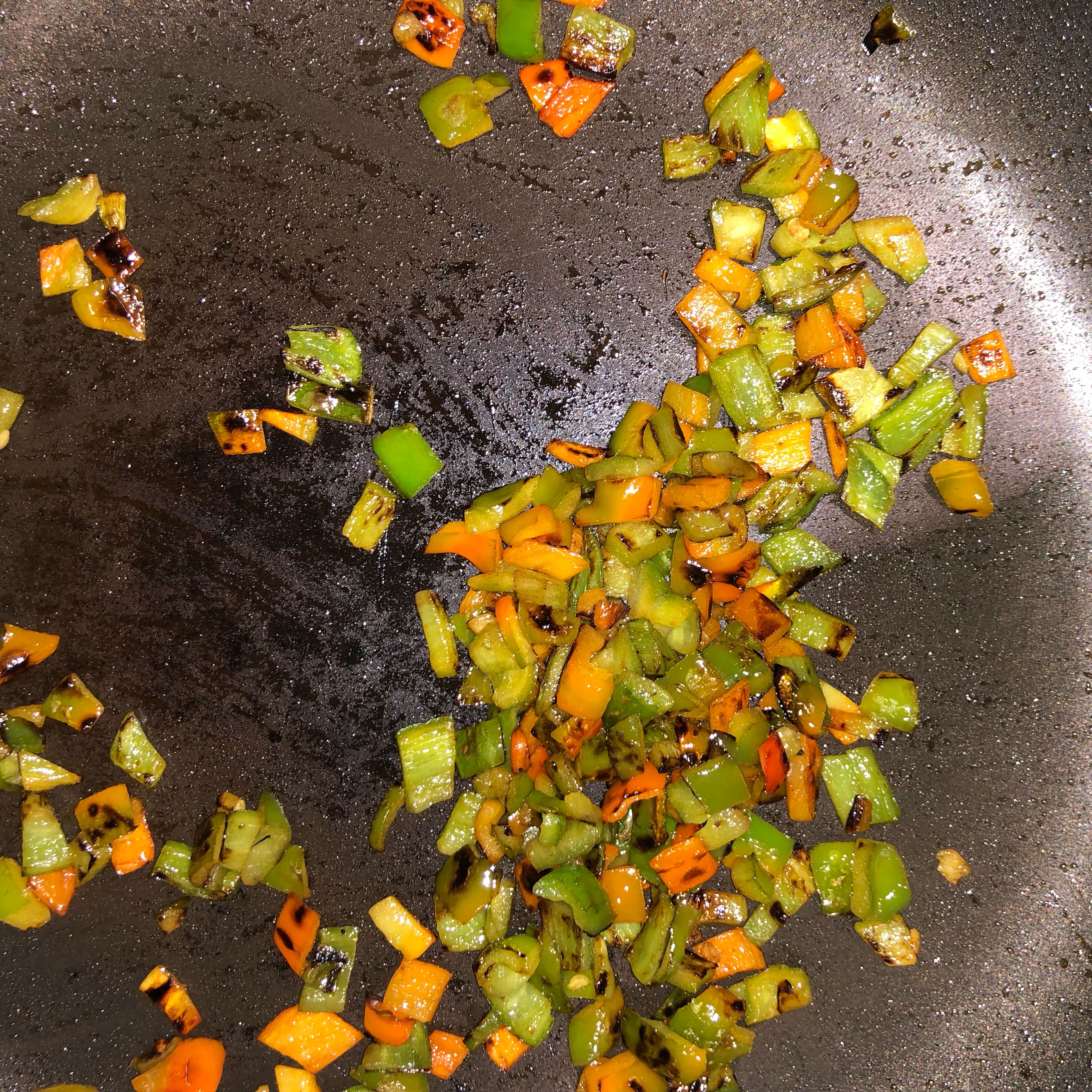 Add a bit of olive oil on the pan and saute the green bell peppers.