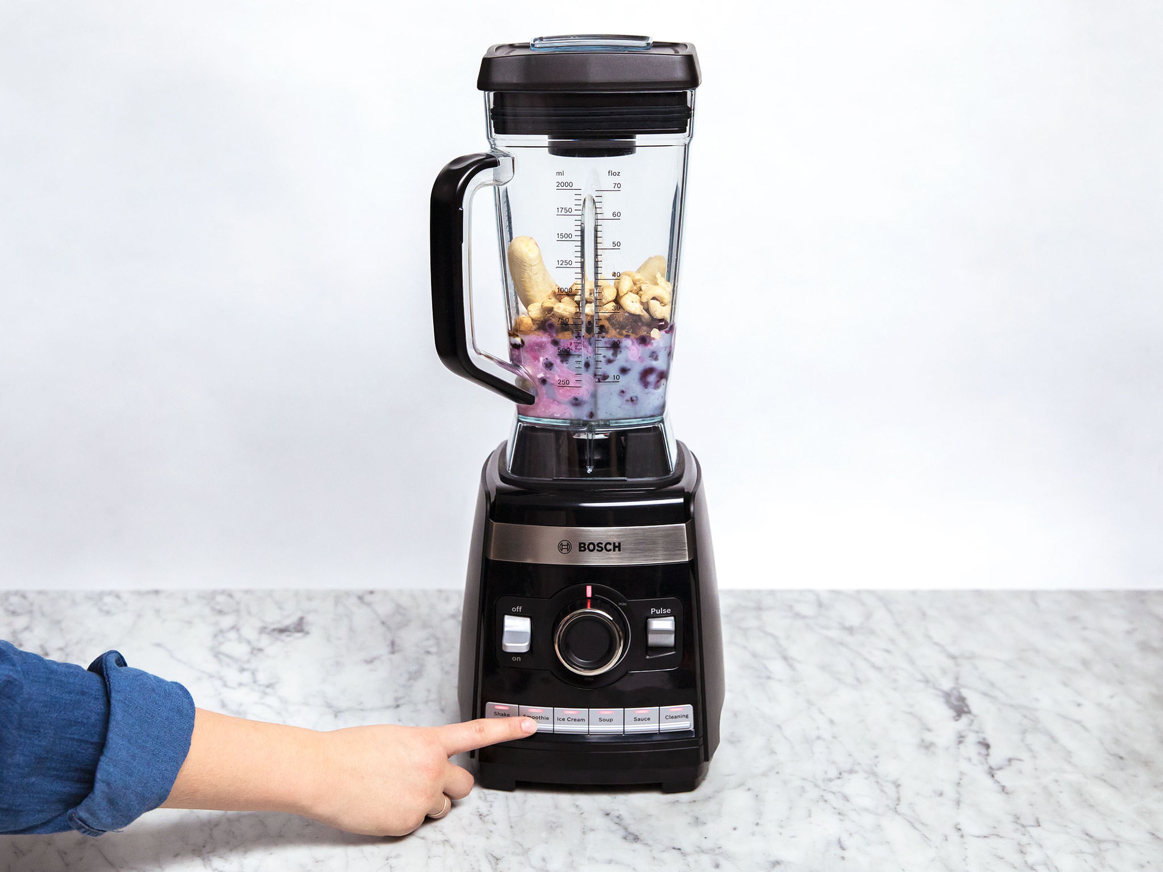Add frozen blueberries, soy milk, soy yogurt, honey, freshly squeezed lemon juice, cinnamon, and cashews and blend until smooth (using your blender's smoothie function). Enjoy!