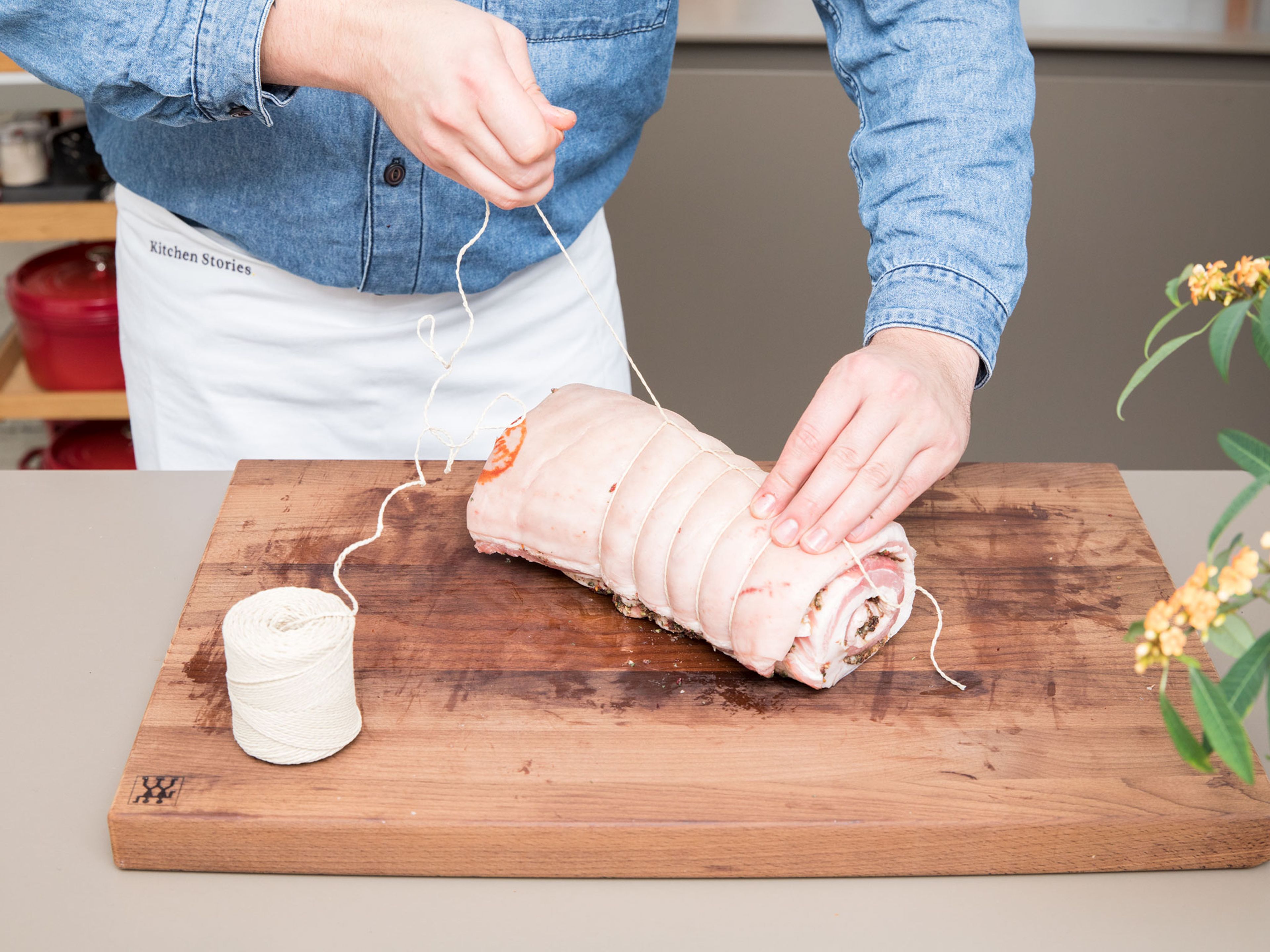 Roll pork belly into a log and use kitchen twine to tightly tie it up, leaving about 3/4-inch/2-cm of space between each section. Transfer the rolled pork to a baking dish and leave in the fridge for at least 12 hrs., or overnight, for the skin to dry out. On the next day, take the meat out of the fridge an hour before cooking to bring it down to room temperature.