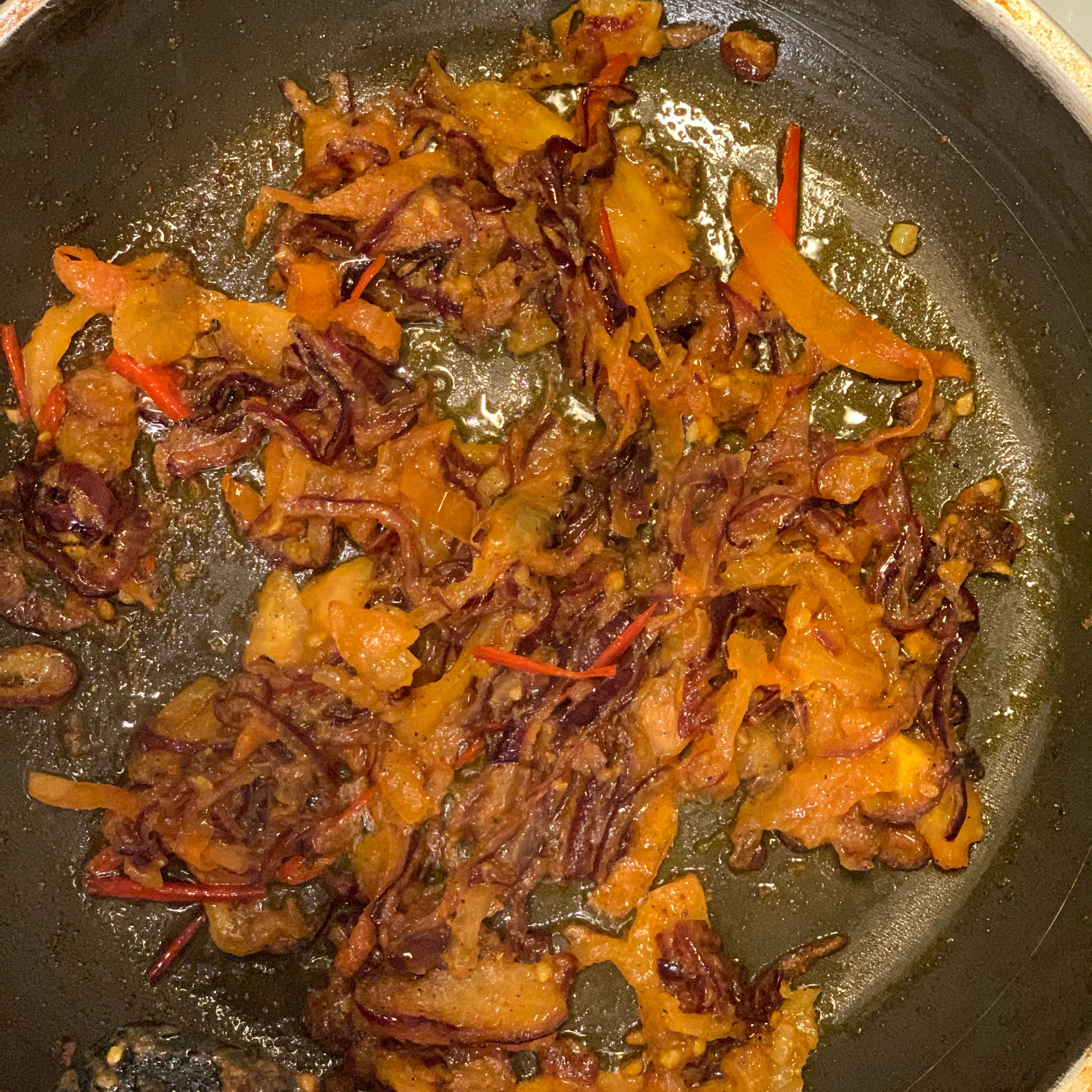 Add chopped tomatoes to the fried onions and add 1 tbsp turmeric, 1 tbsp ginger, 1 tbsp chilli powder and salt to taste. Keep stirring so that it is not burnt.