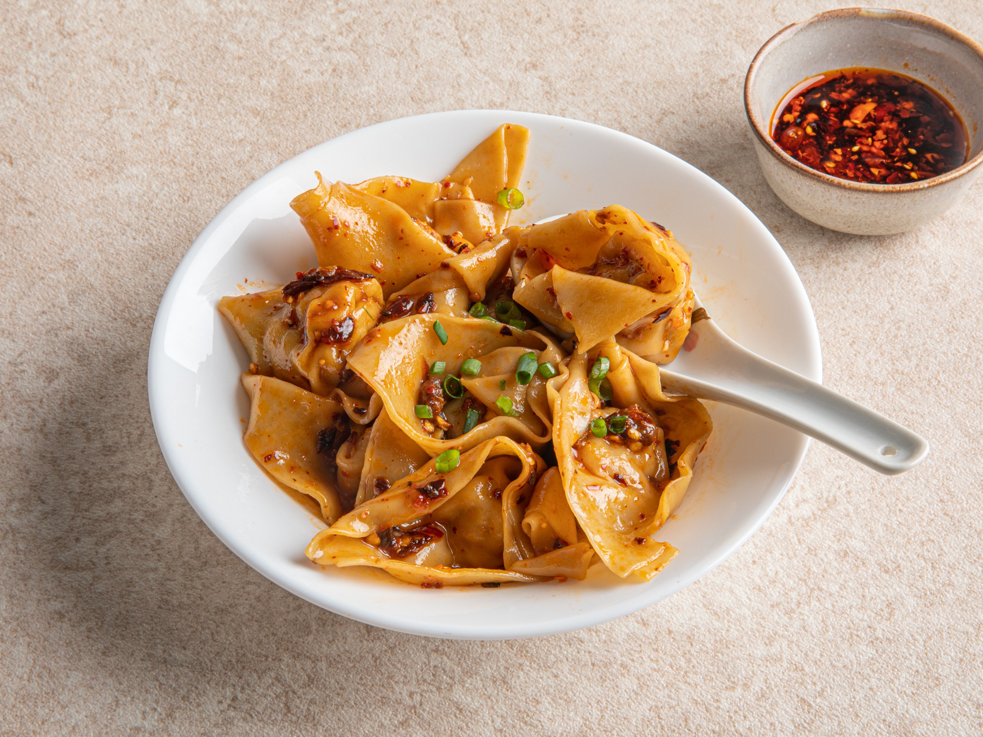 Xueci makes Sichuan chili wontons