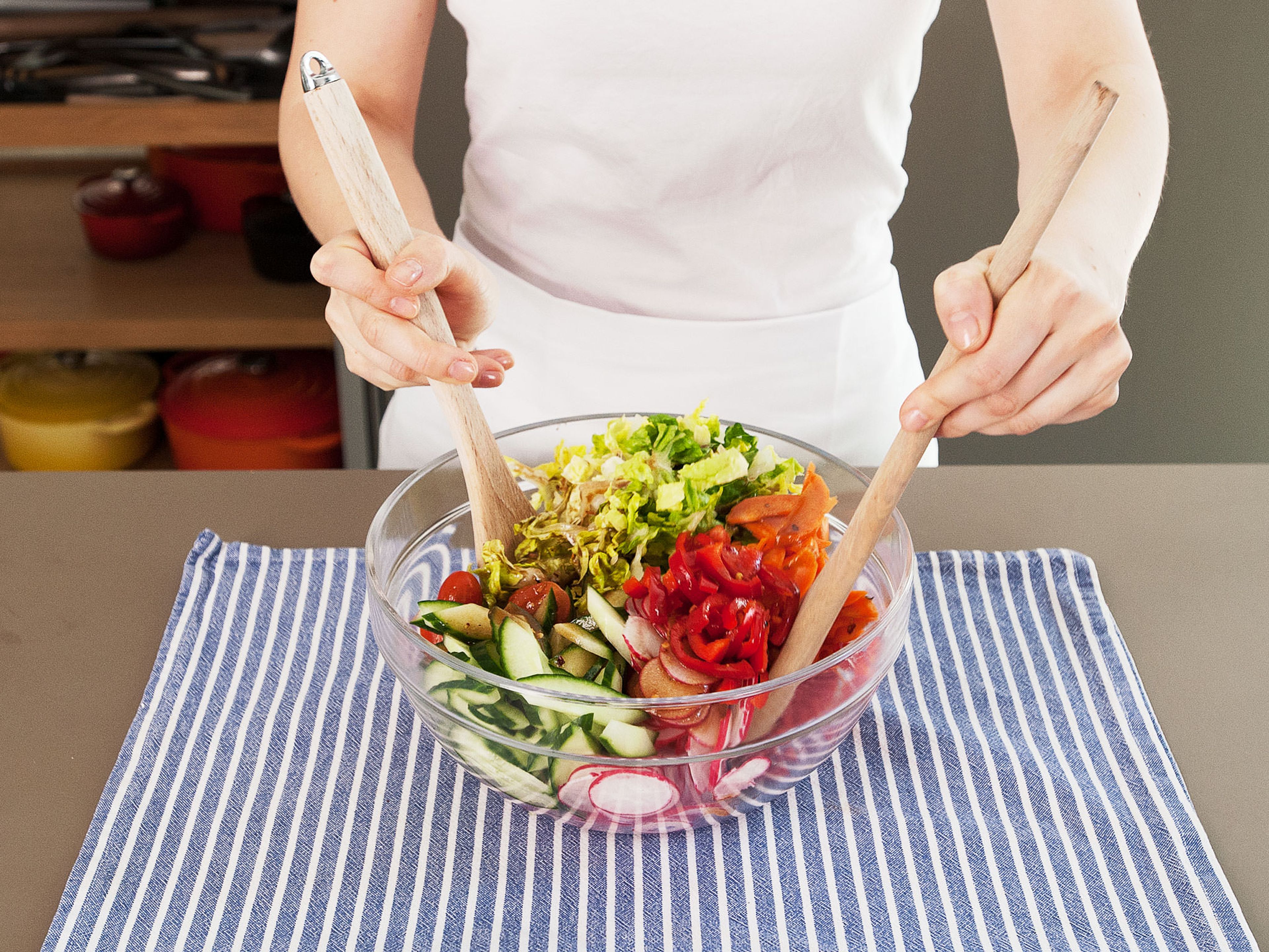 Pour dressing over the salad, a small amount at a time, and toss until well combined. Enjoy!