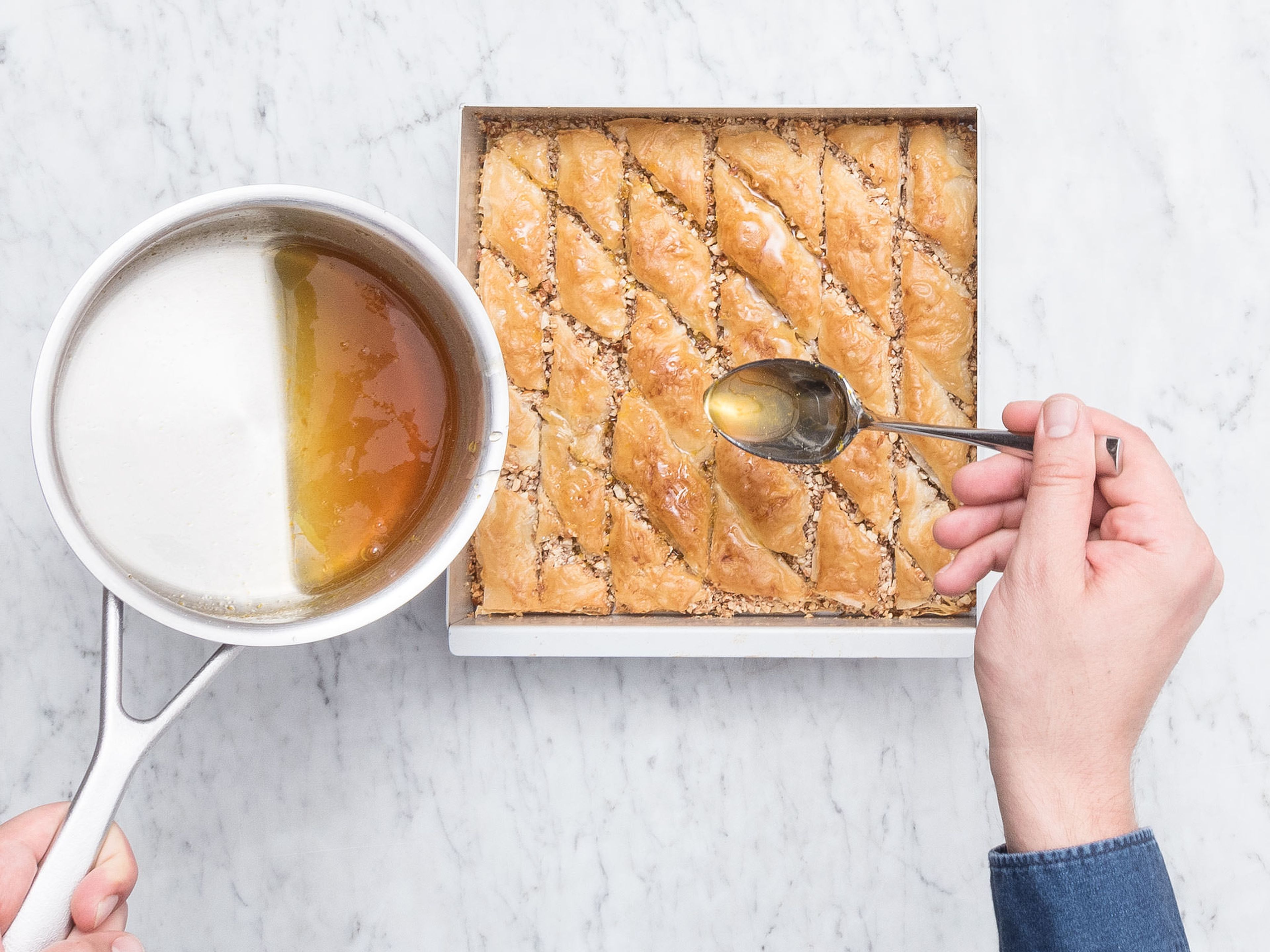 Remove from oven and slowly pour the syrup all over the baklava, allowing enough time for it to absorb. Let the baklava cool completely before removing from the tray with the help of an offset spatula. Enjoy!