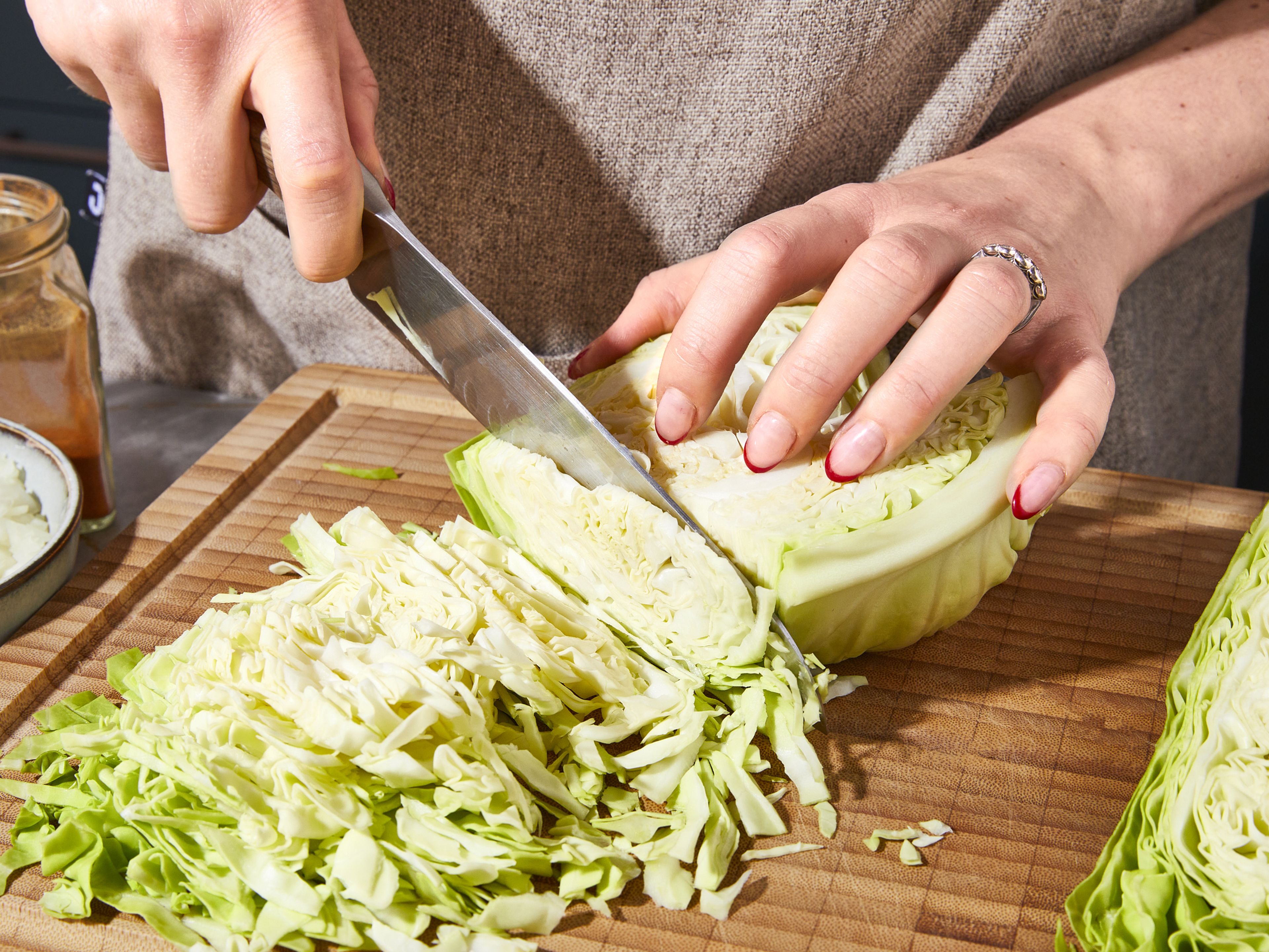 Finely chop onion and garlic. Remove outer leaves and stalk from cabbage and cut into very thin strips.
