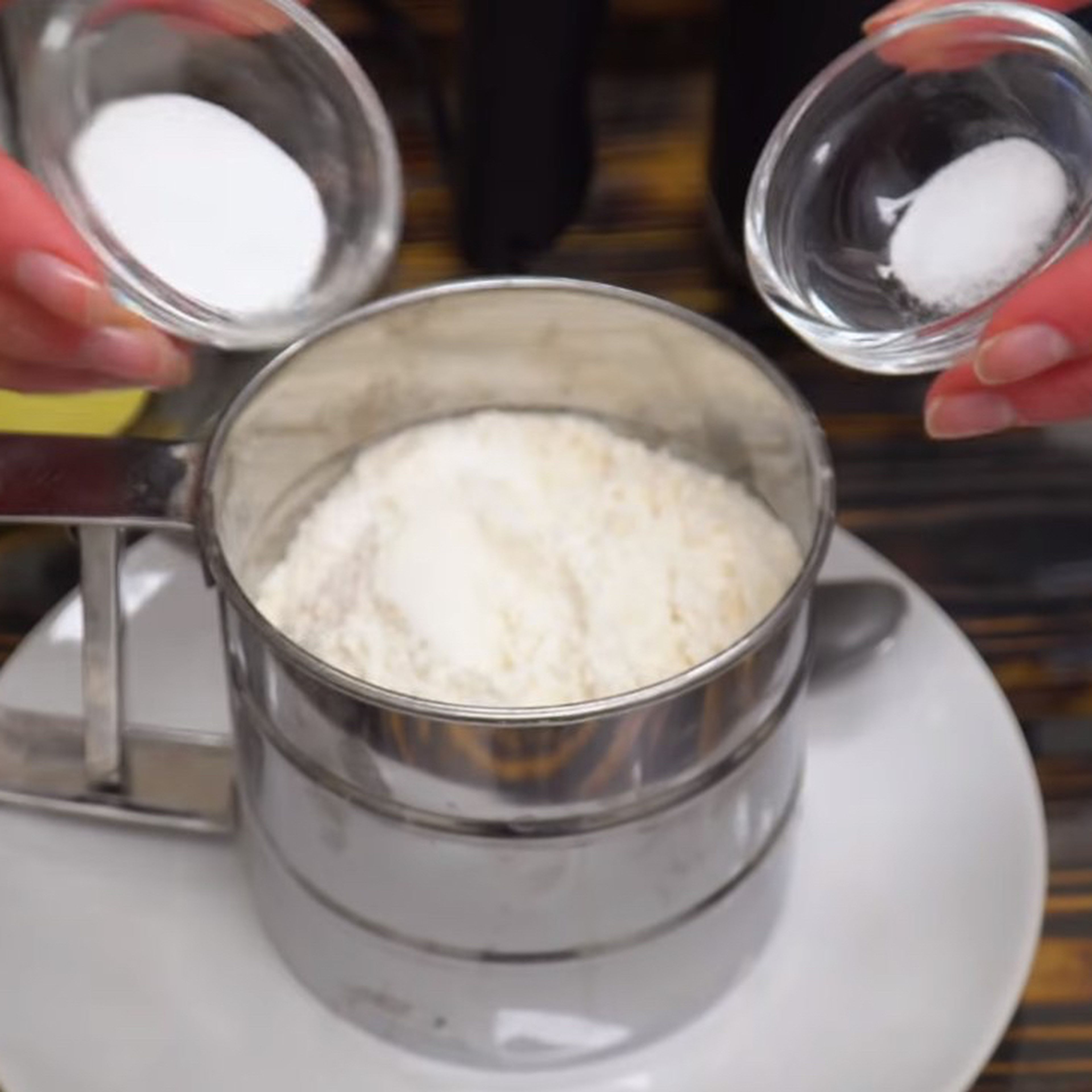 Add soda and vanilla powder to flour. Pour the resulting flour in two stages into a bowl with liquid mixture, stirring for 20 seconds each time.