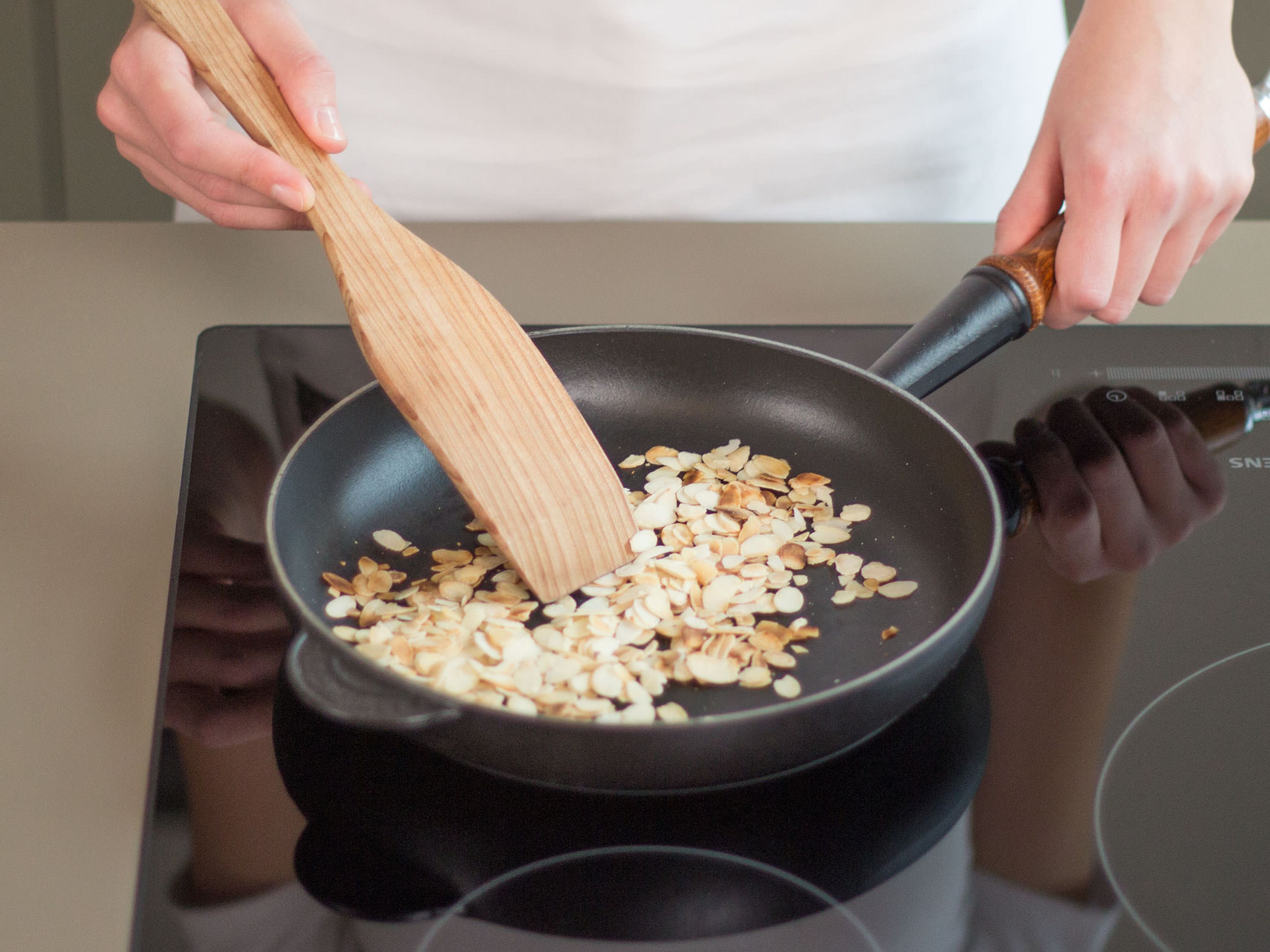 In a large, grease-free saucepan, toast almonds over medium heat for approx. 1 – 2 min. until golden brown and fragrant.