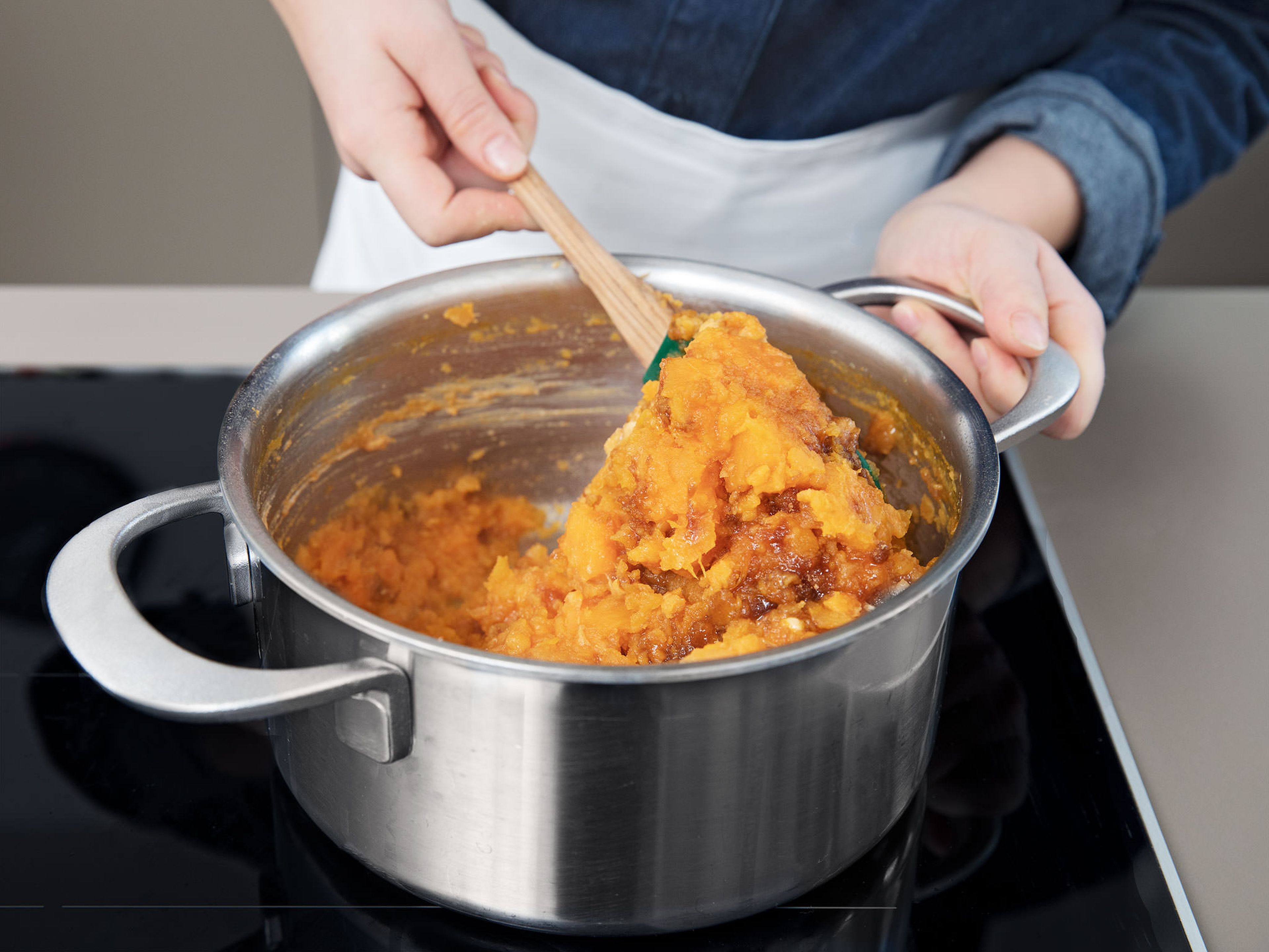 Add sweet potatoes to a large pot and cover with water. Add the butter. Bring to a boil over medium-high heat for approx. 20 – 30 min. (time depends on size of chunks). They are done when you can easily stick a fork through them. Don't overcook. Drain about three quarters of the water from your pot and return to stove.
