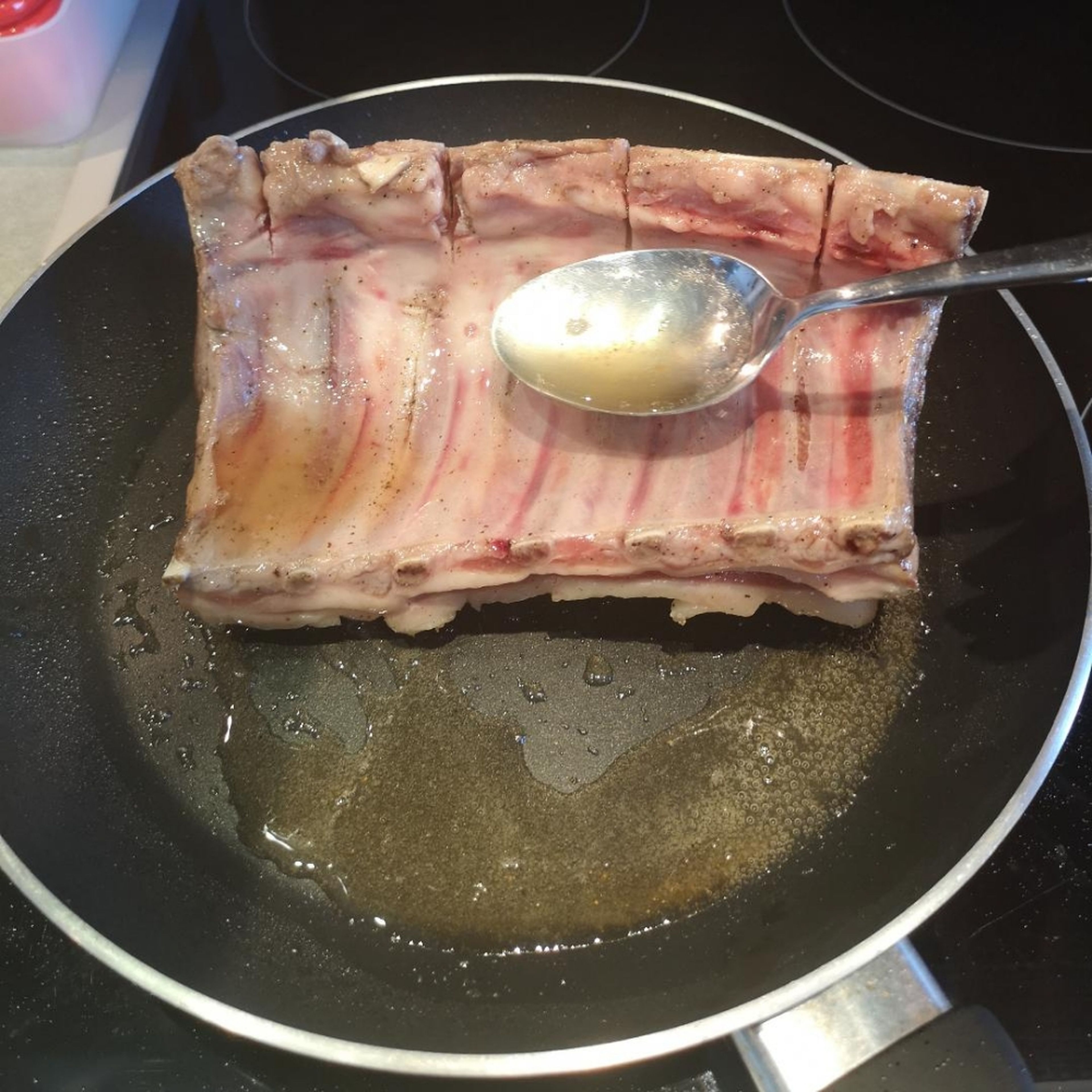 the bone part is the hardest to sear as the angle makes it impossible to get it in contact with the pan. once you've seared all the sides, grab a spoon, tilt your pan and spoon the hot fat onto the lamb, soon you will notice it getting darker and darker!