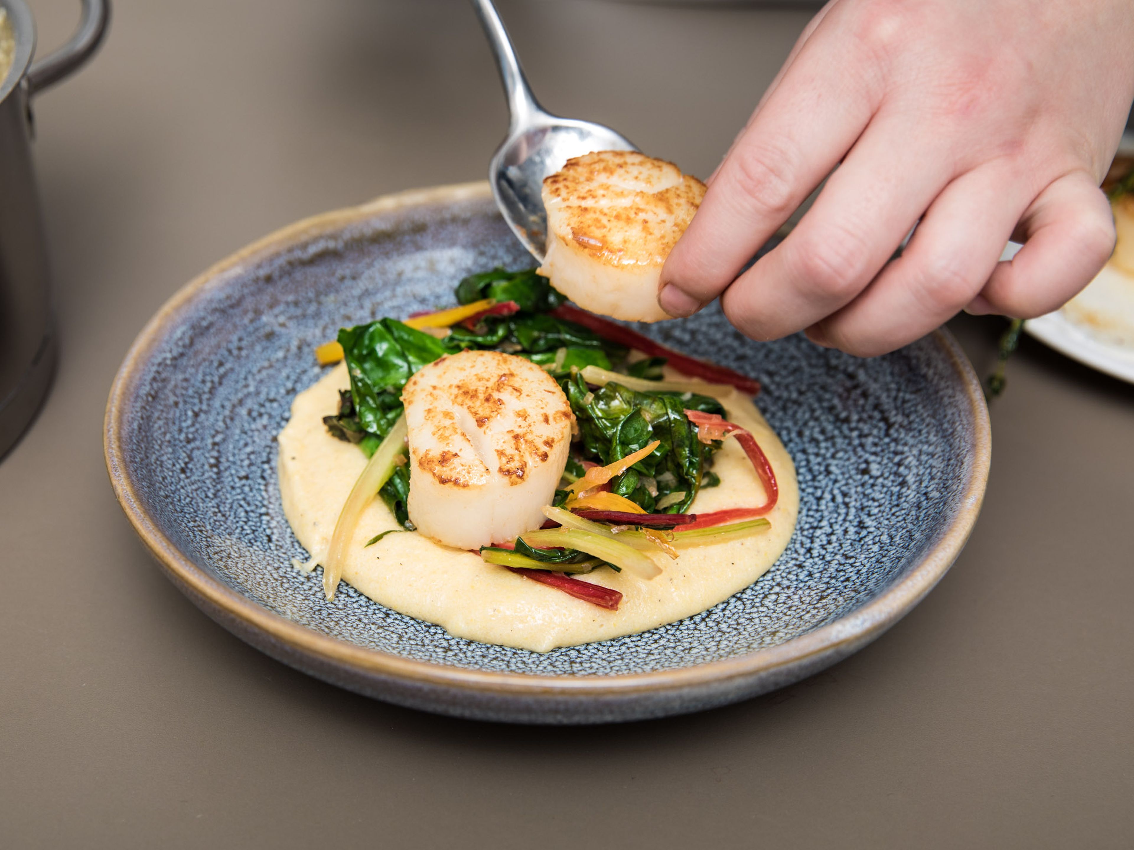 Serve polenta with Swiss chard and scallops on top. Enjoy!