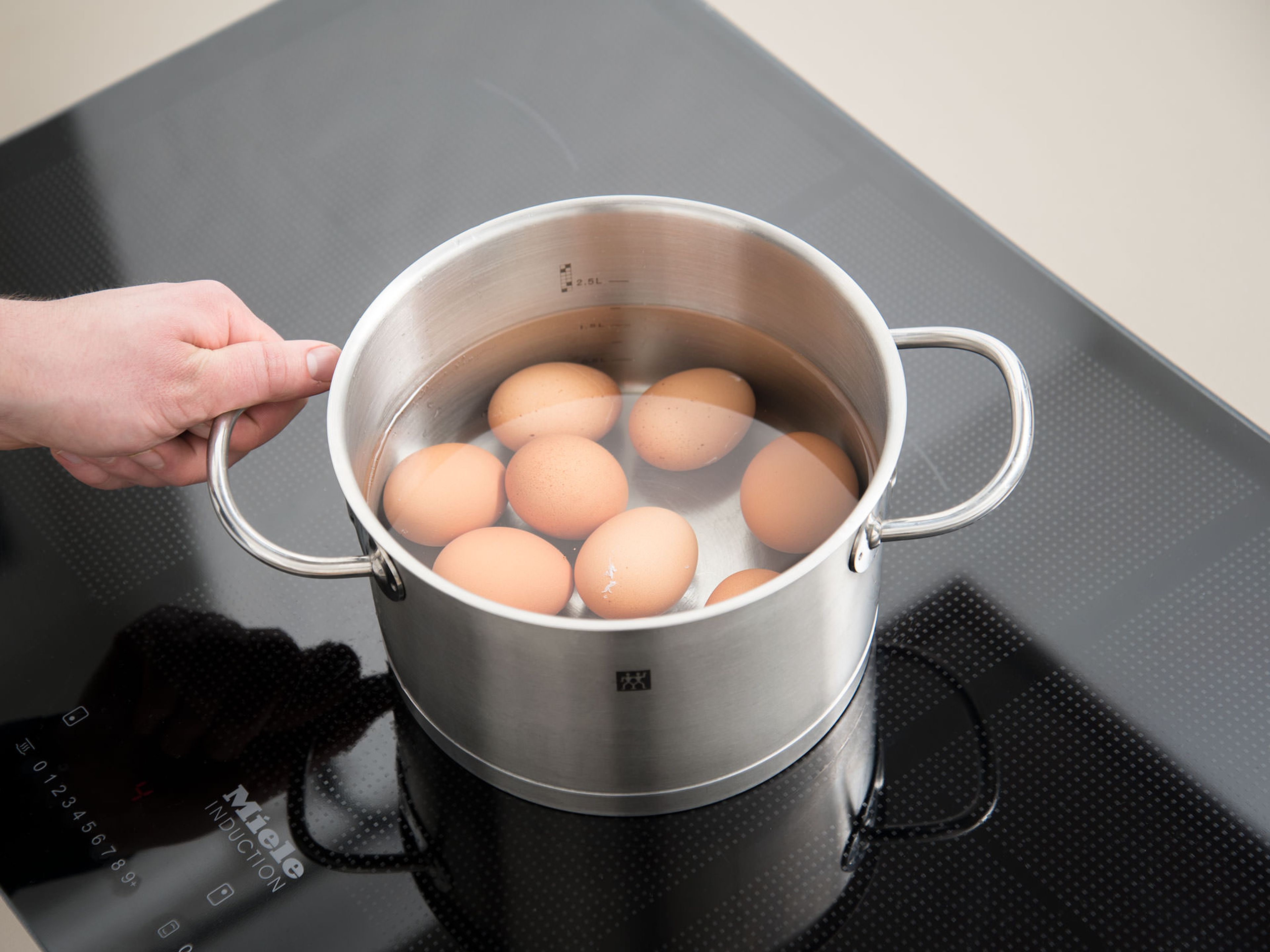 Add eggs to a pot with water. Bring to a boil and cook for approx. 8 min. or until hard-boiled.