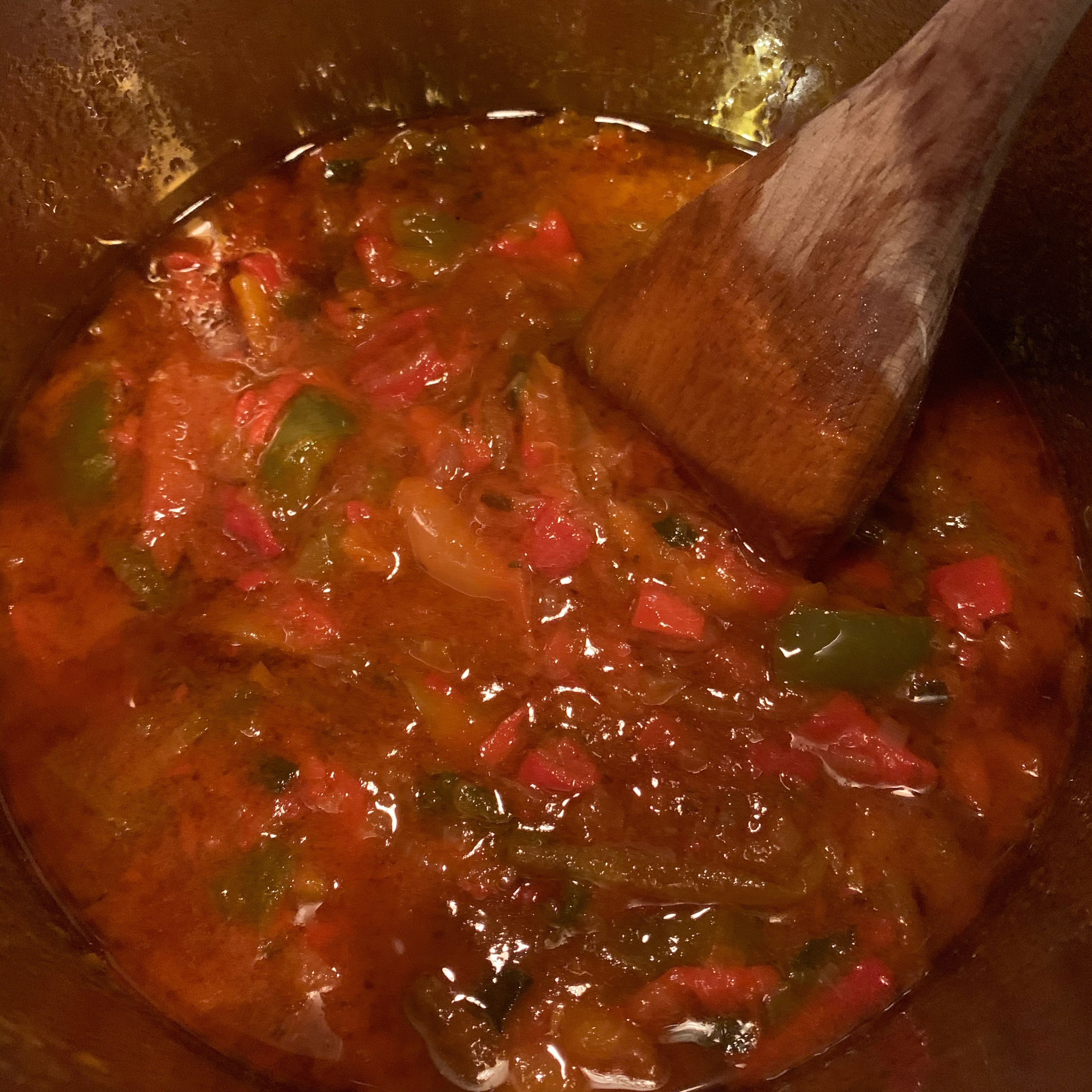 Add in peppers!! Keep heat on medium low and cover pot. Watch the juice from the peppers flow out and concentrate the flavors into the oil by reducing on low heat for the next 5 hours. Once the consistency is thickened a bit, your peperonata is ready!