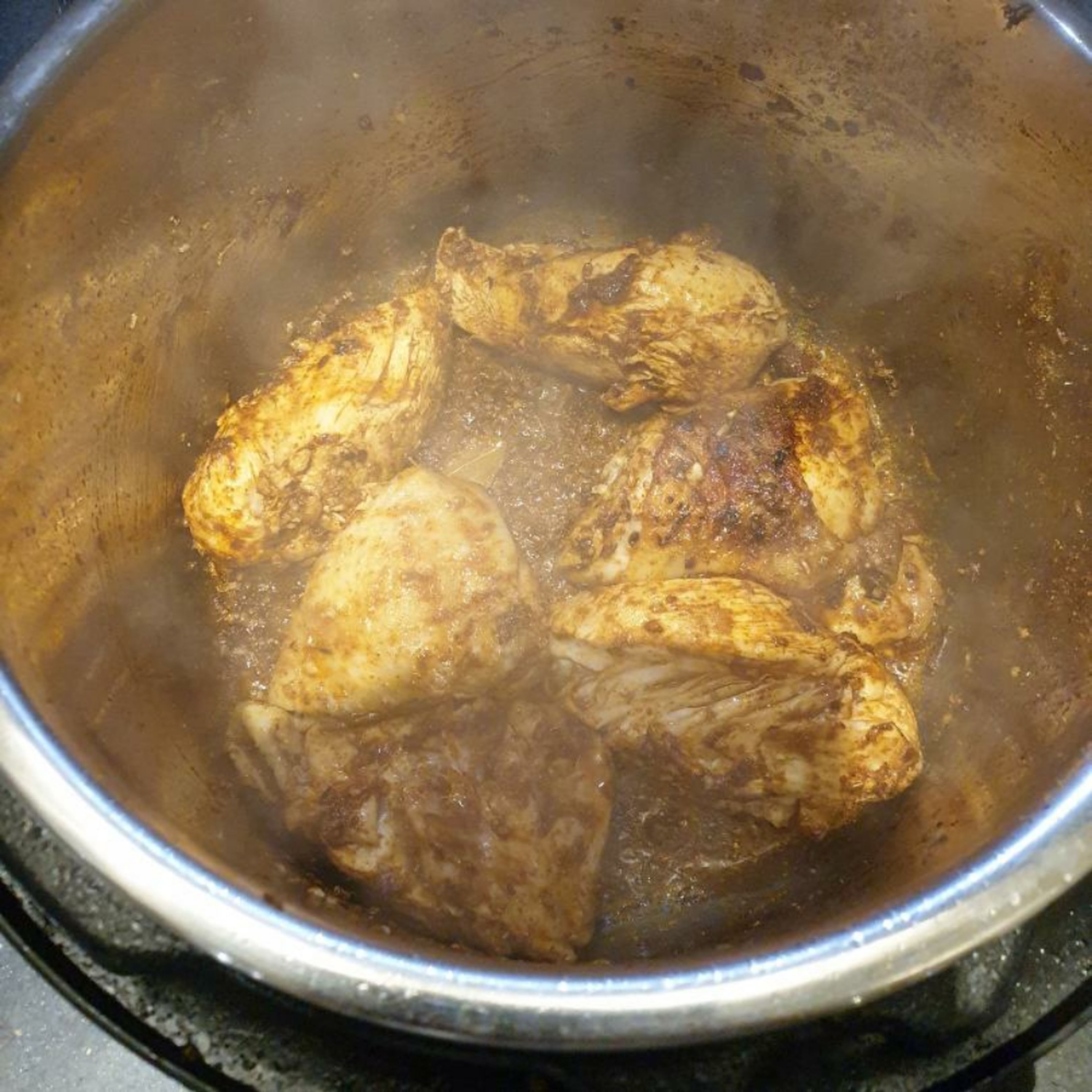 Add the ground spices and mix to coat the chicken.