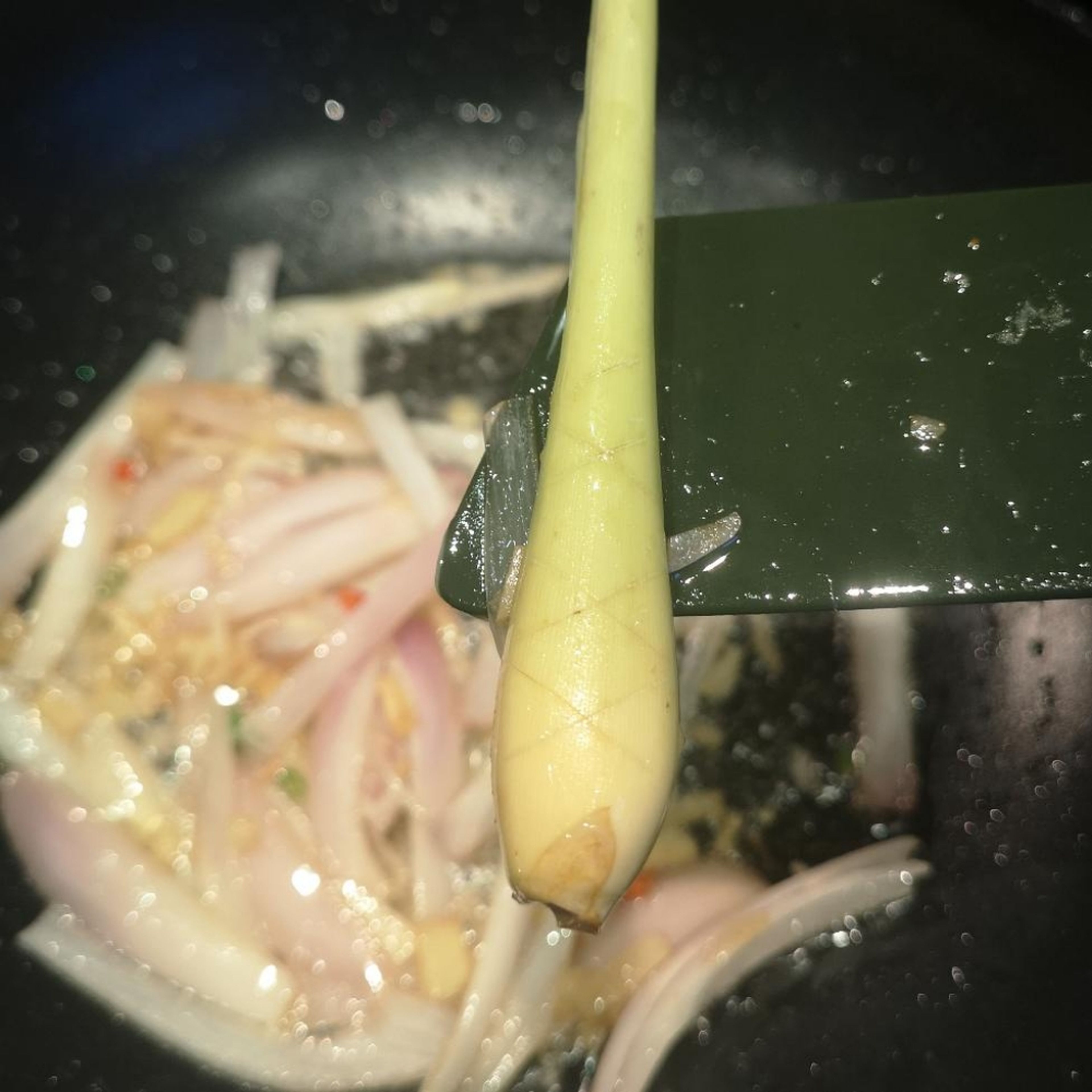 I like to score my lemongrass to get the maximum flavour out, you can cut 'X' shapes onto it without cuting all the way through. don't forget to add your Kafir lime leaf!
