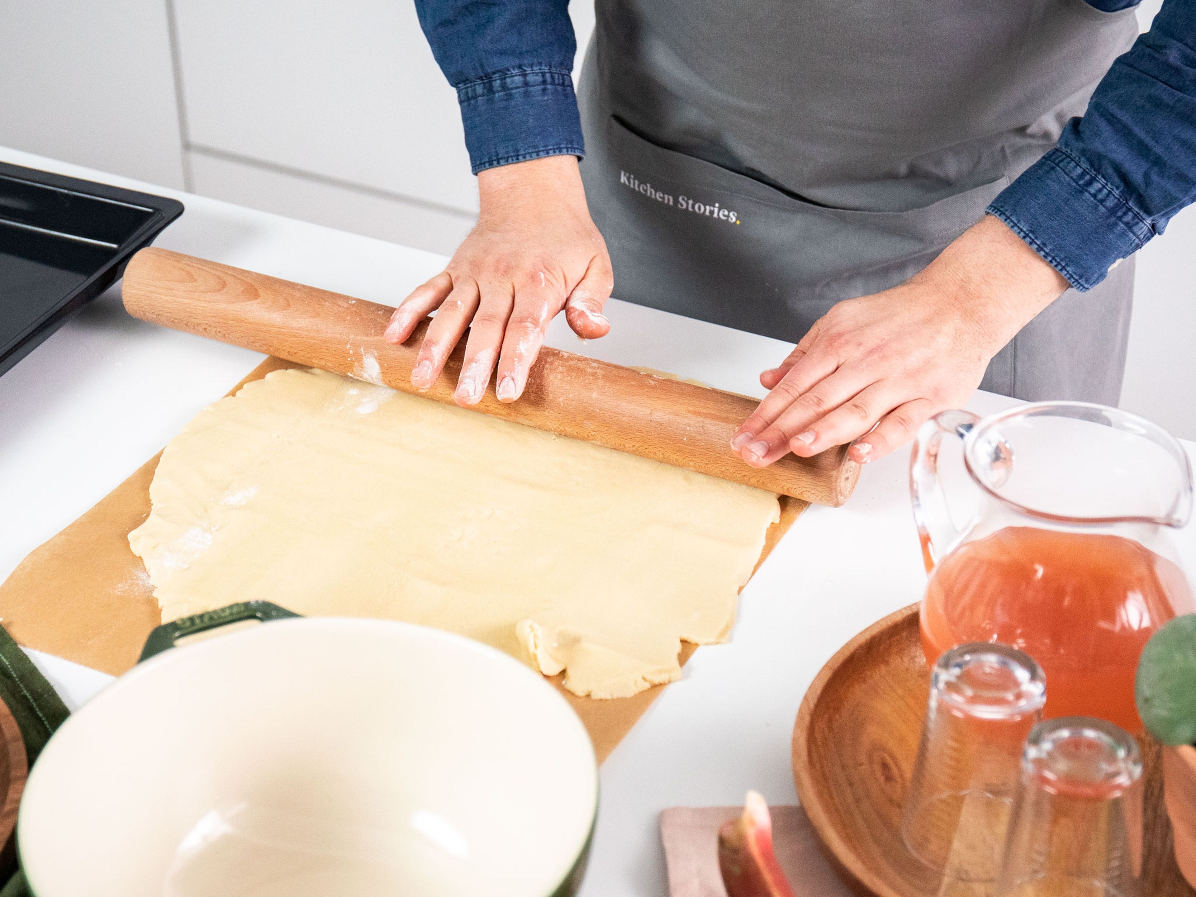 Halve the dough and let one half rest in the fridge. Roll out the second half of the dough between two sheets of parchment paper, until it’s the same size as your baking sheet, then transfer the dough to it.