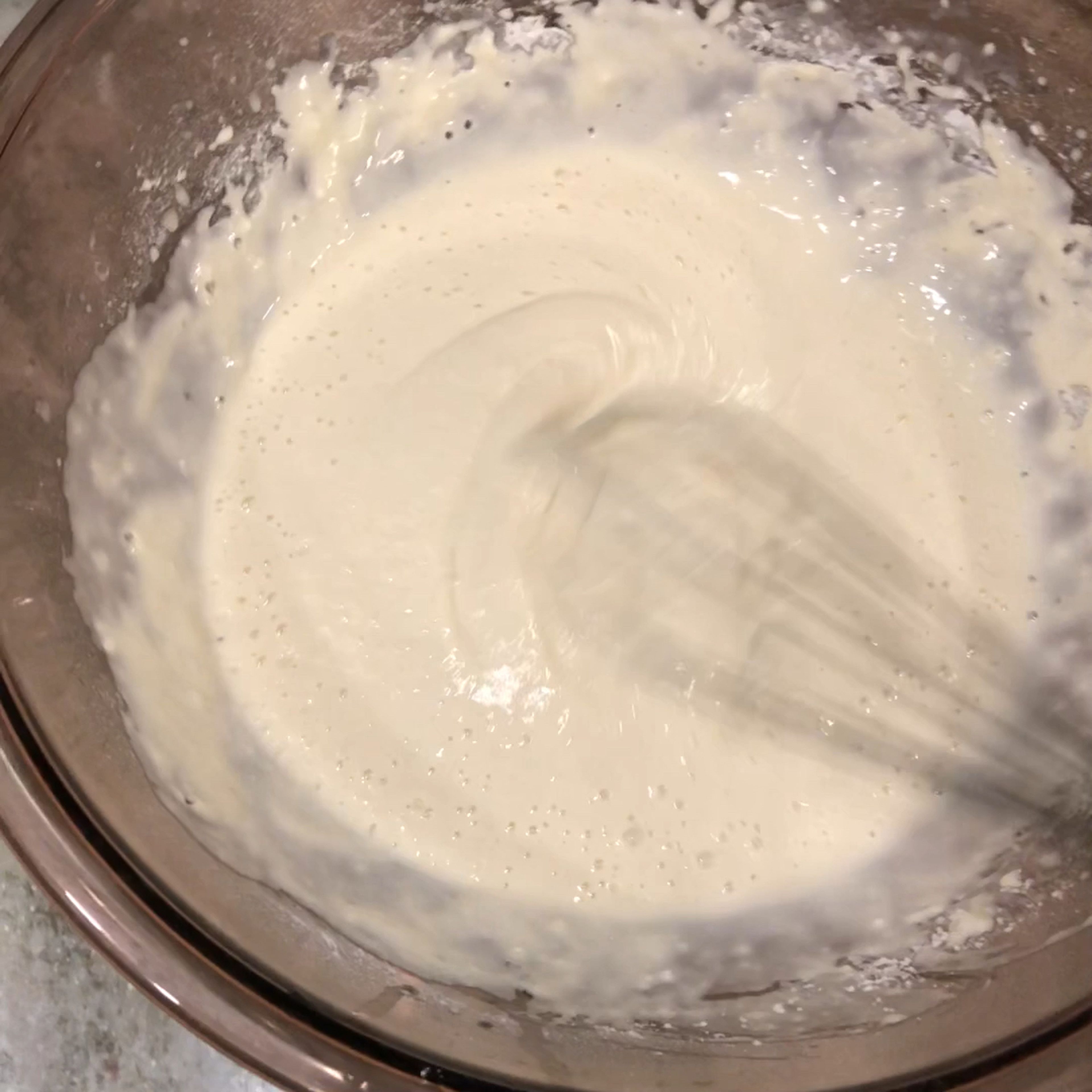 Put 7 Tbsp of flour into the bowl. Keep adding until the consistency is like the one in the video