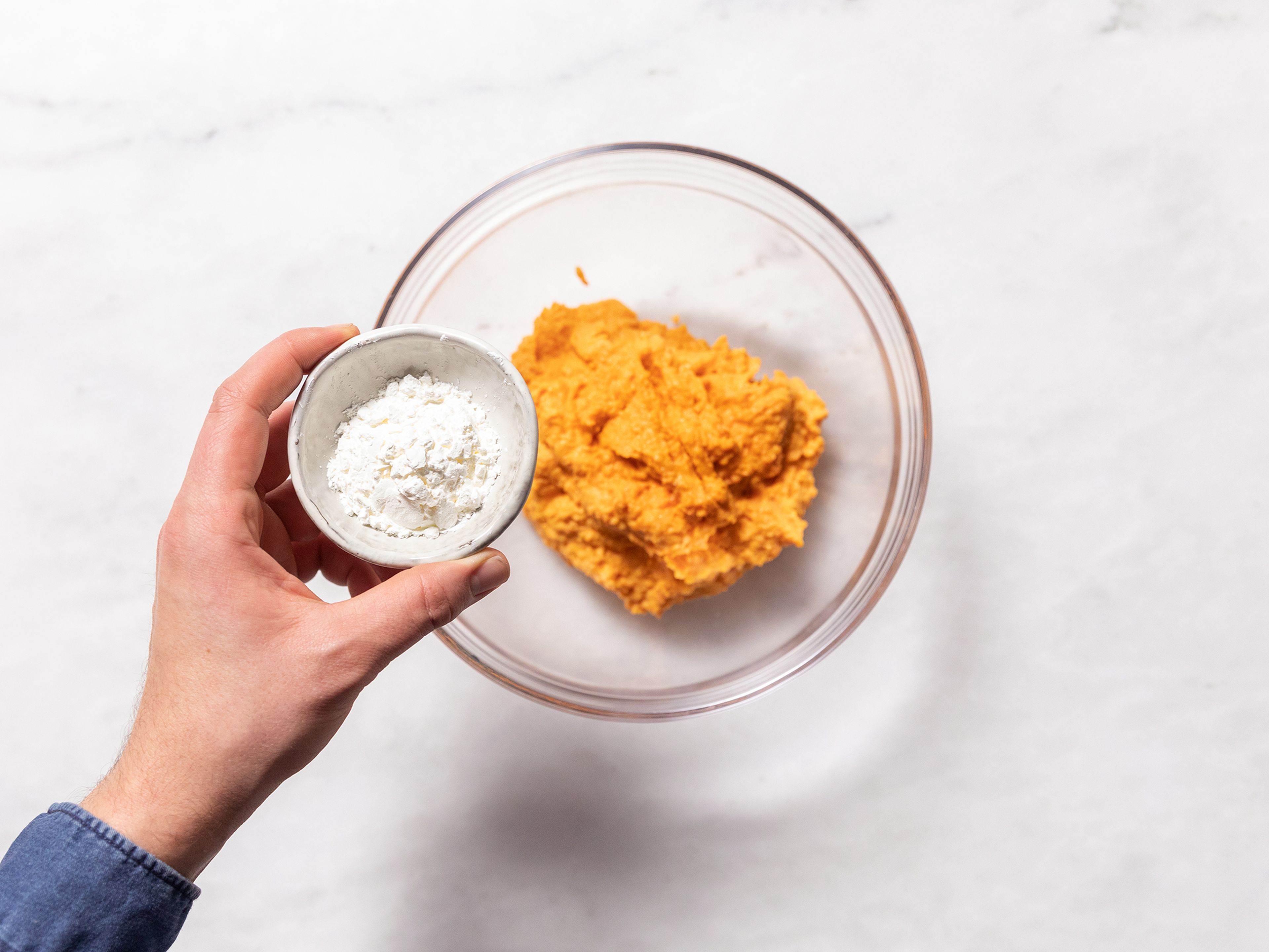 Add roasted carrots, ricotta cheese, egg, and some salt to a food processor and blend until smooth. Transfer carrot puree into a large bowl, add starch and flour gradually. Allow to cool in the fridge, if desired.
