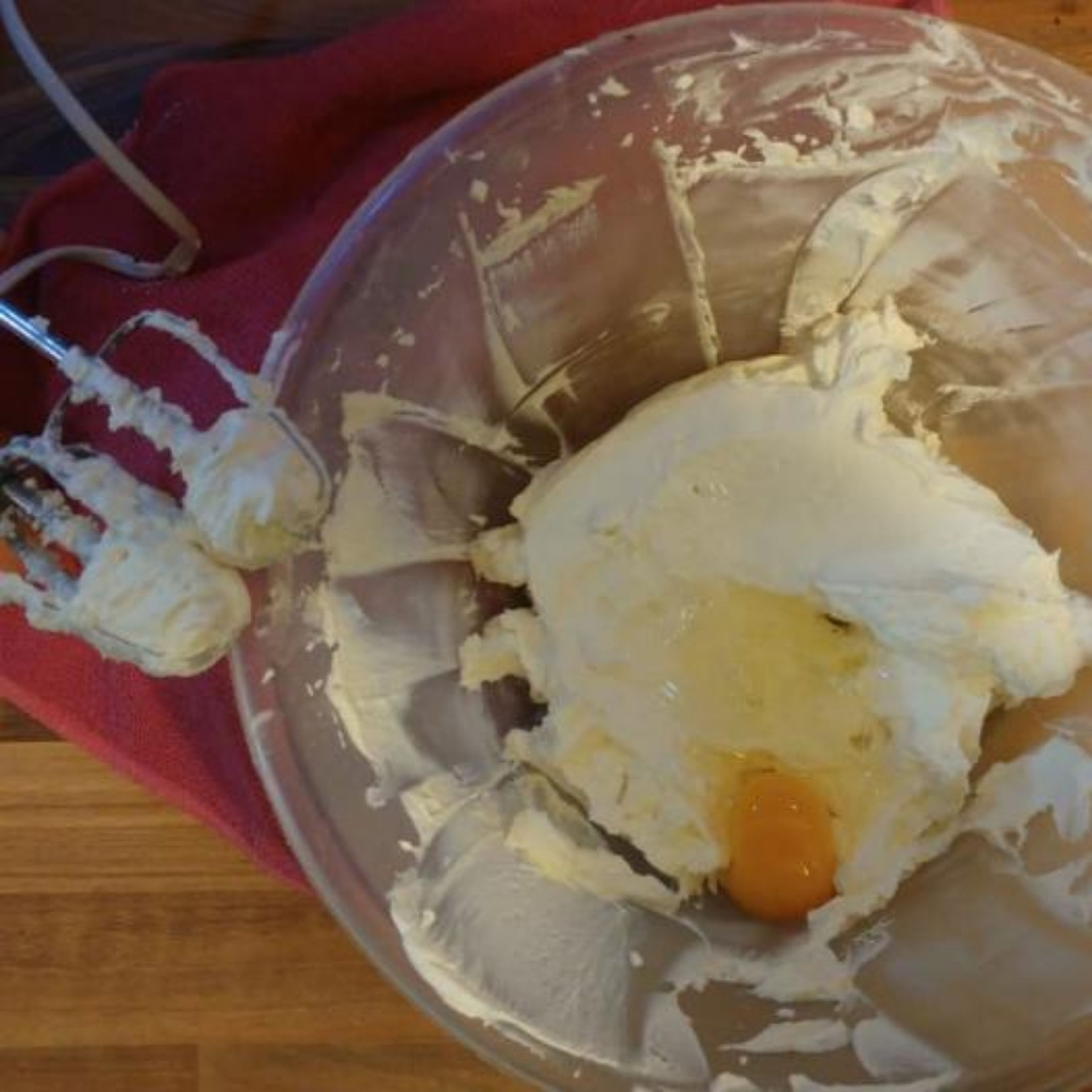 Using and electric whisk, whisk the ricotta and mascarpone together for 3 minutes. Add the eggs, one by one, adding the next egg after the previous has been fully incorporated. After you have added all the eggs, whisk for 5 minutes.