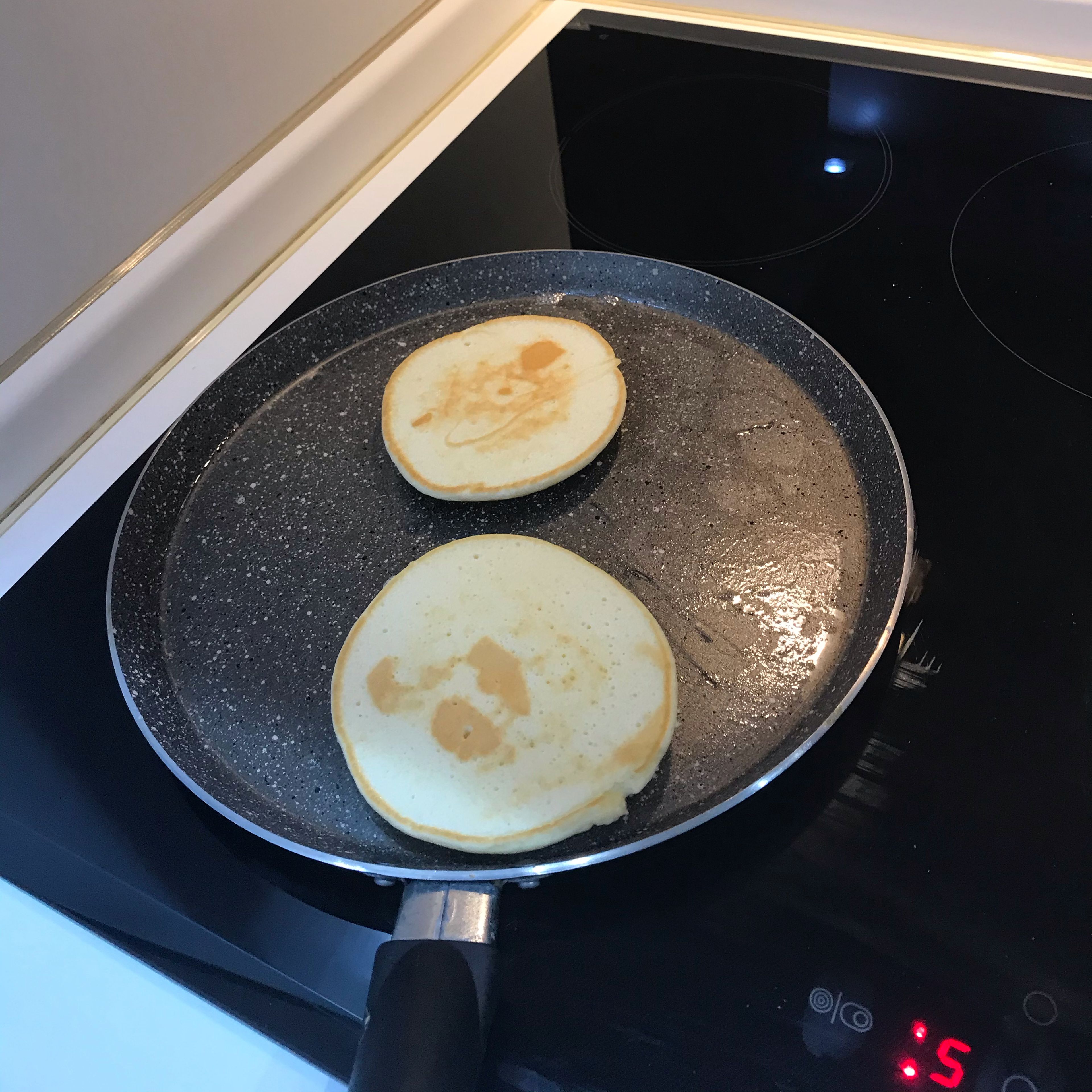 Finally heat the pan, put in a drop of oil and fry the pancakes over medium heat.