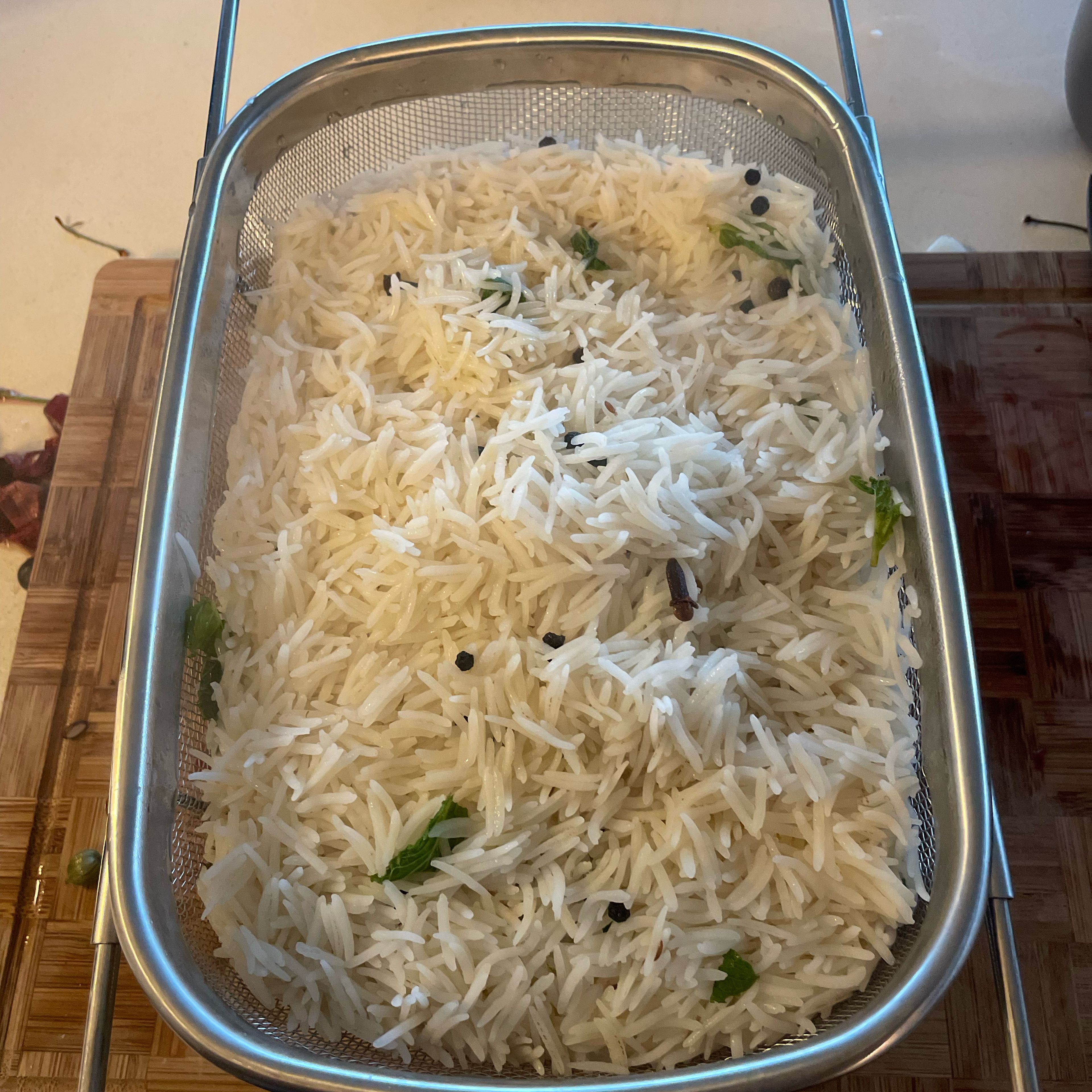 Drain out the water from the rice using a colander, when 80% cooked. This will ensure rice is not overcooked.