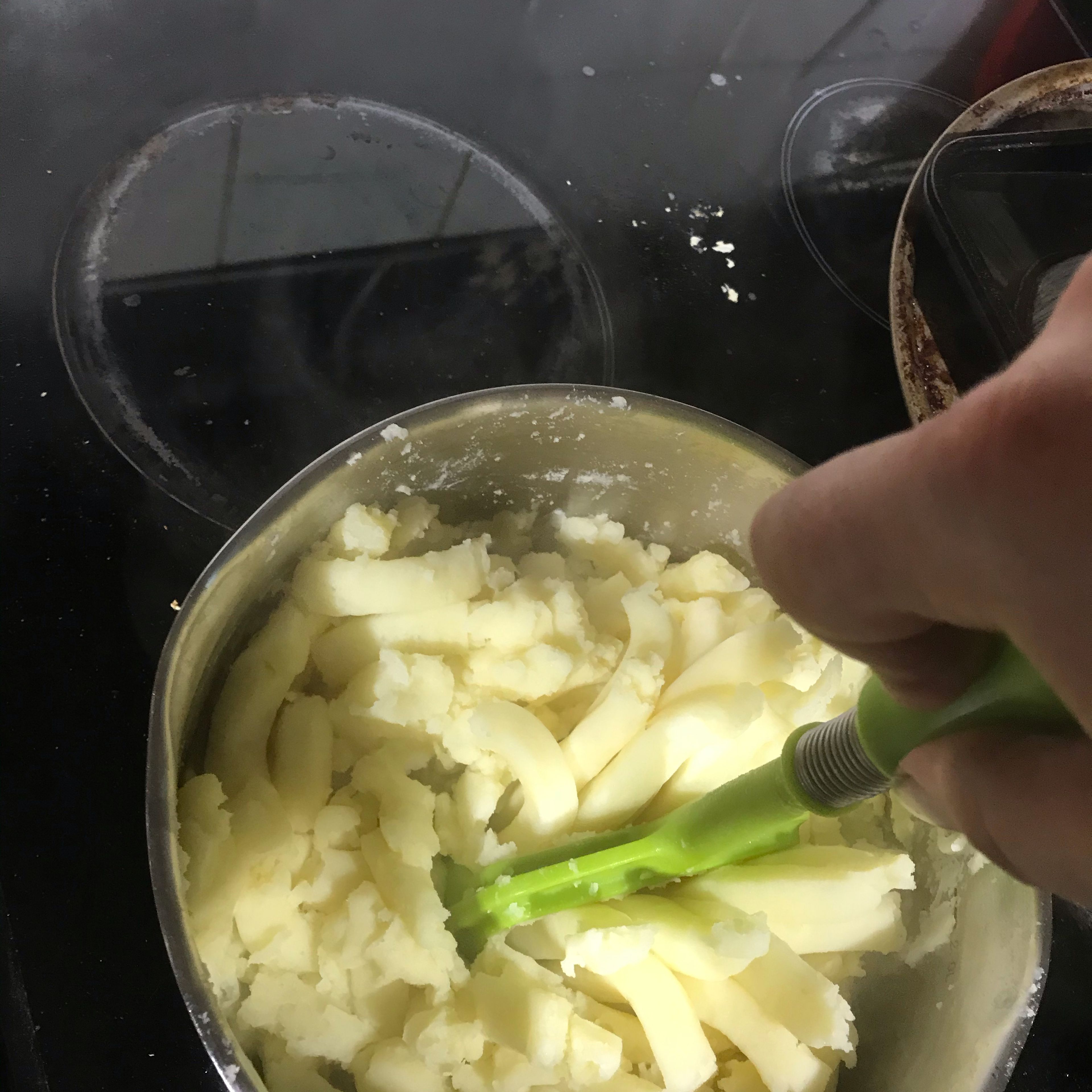 Drain, then mash potatoes with butter add milk until smooth.