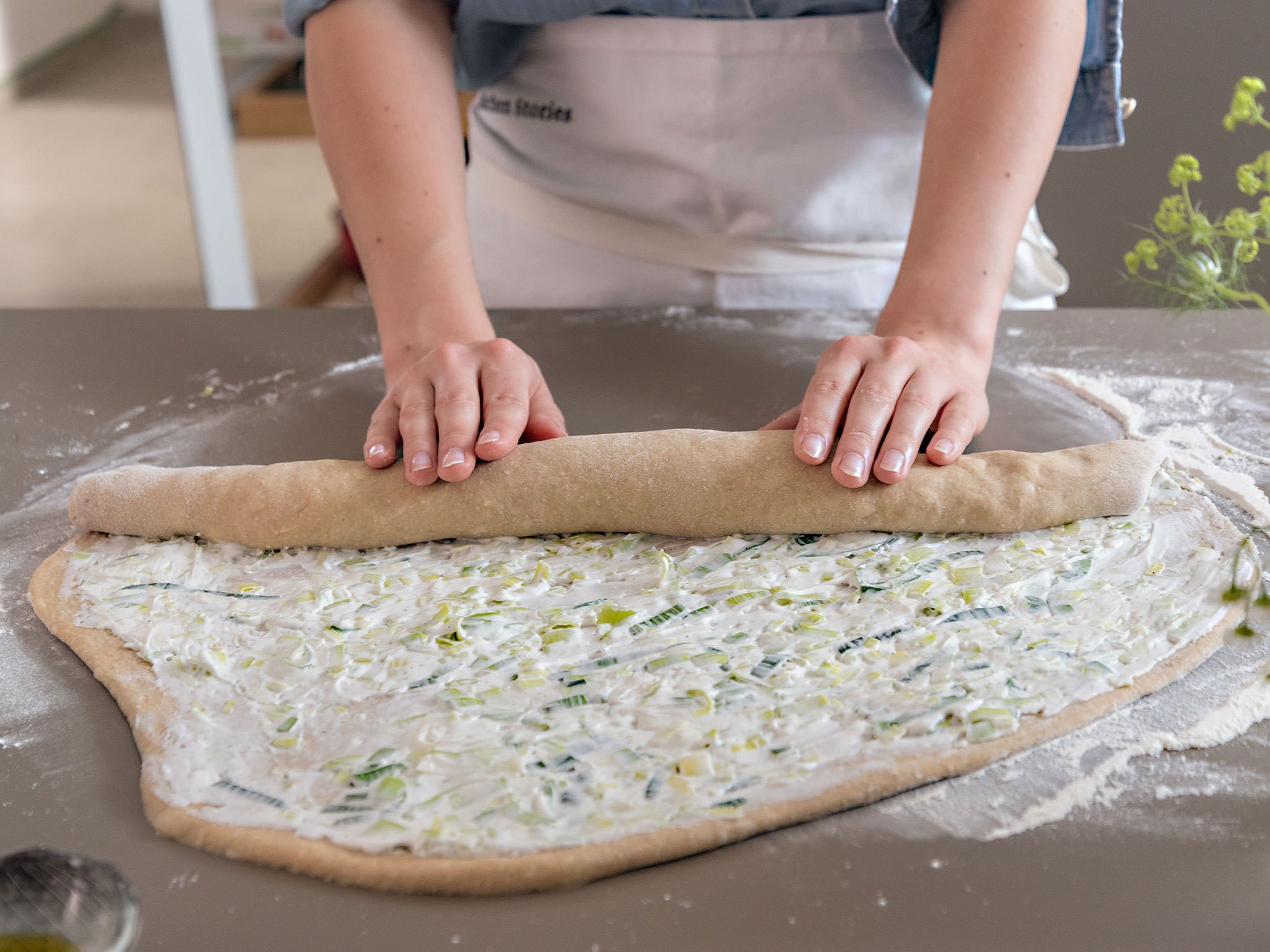 Roll the dough on the long side into a a tight log, like you would a carpet.