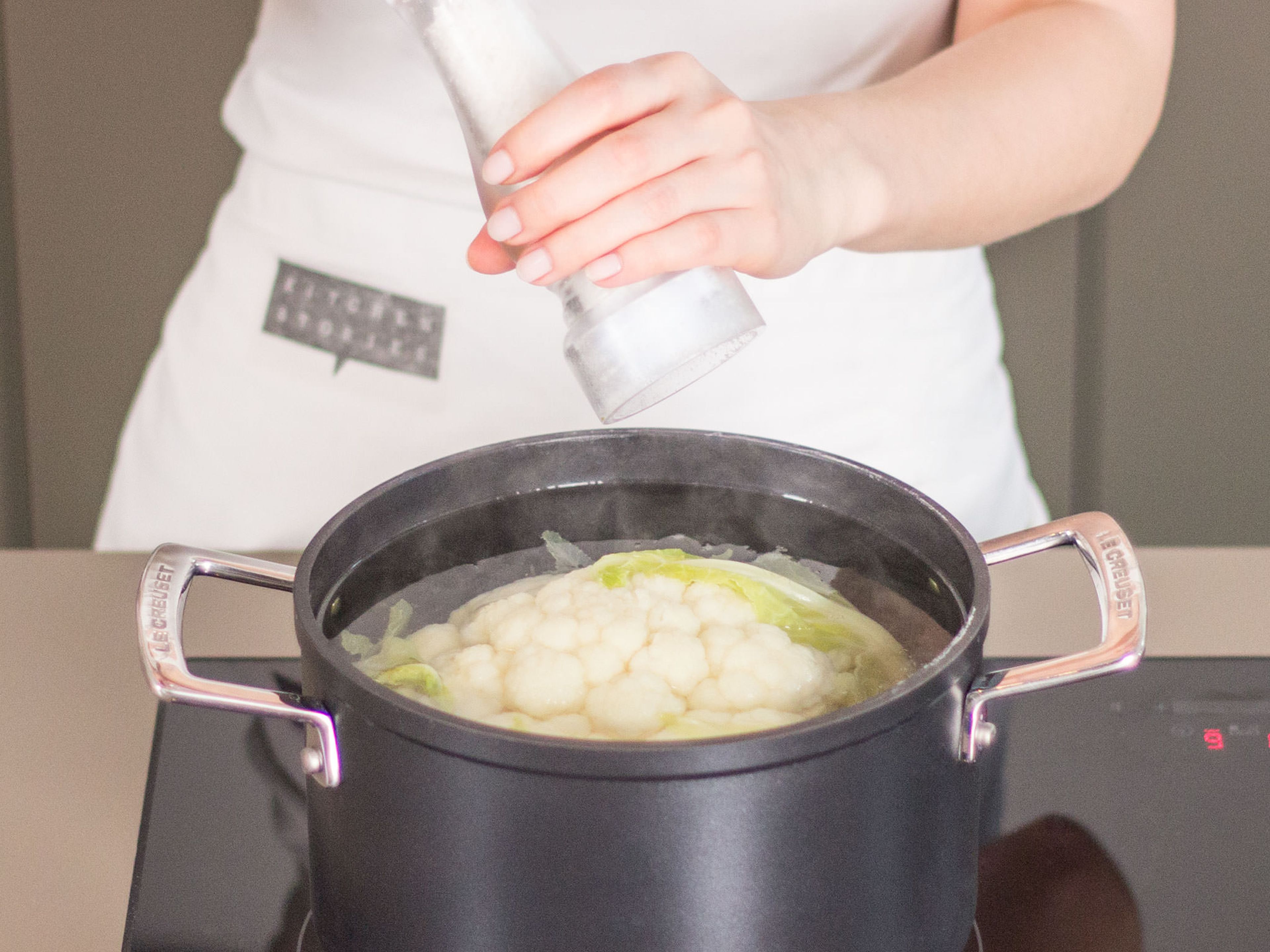 Place cauliflower in a large pot and cover with water. Add a pinch of salt. Bring to a boil and let simmer over medium-high heat for approx. 5 – 10 min.