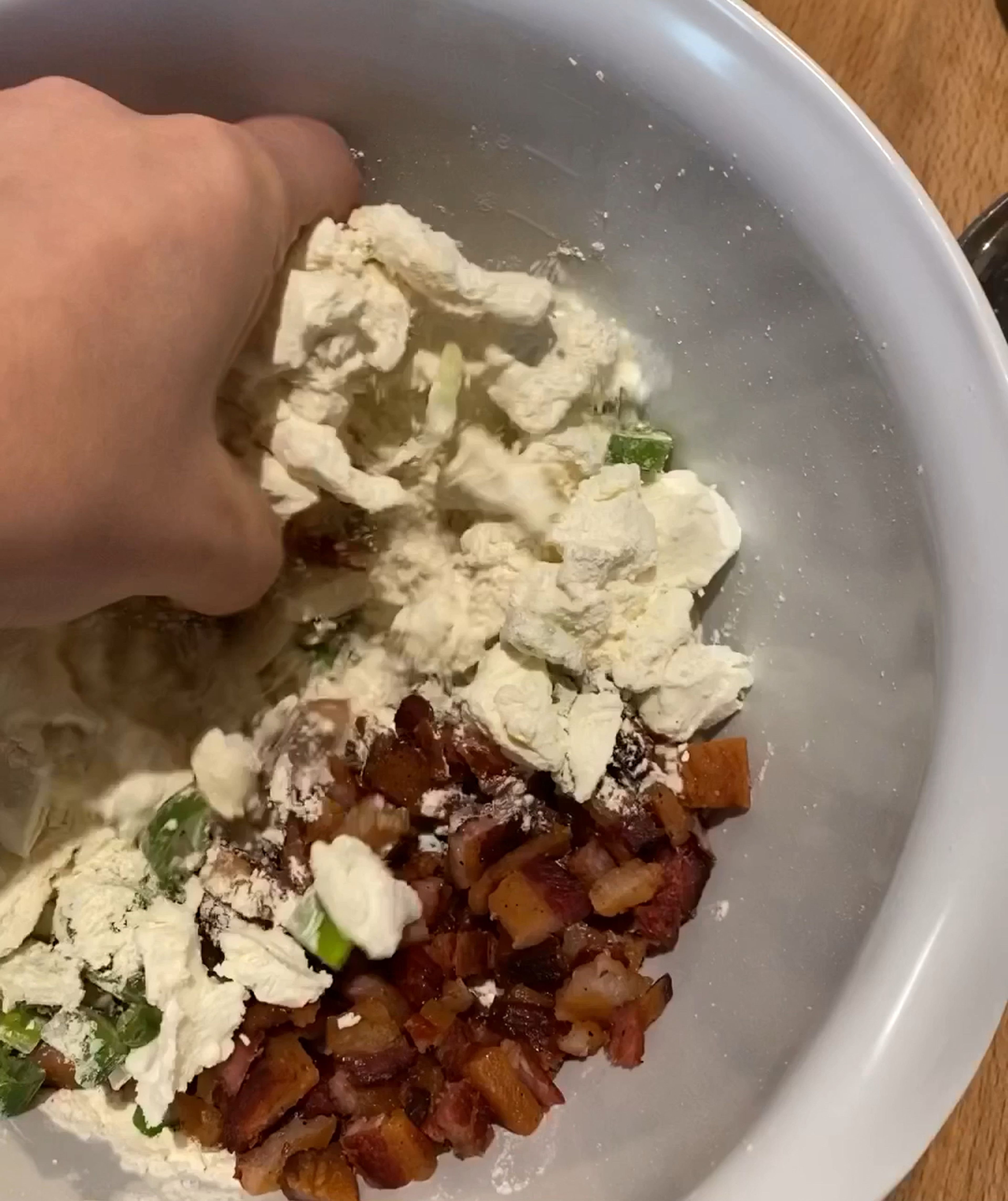 Fry the bacon until crispy and set aside to cool and drain on a sheet of paper towel. Roughly chop or crumble with your fingers. Chop the scallions and crumble the goat cheese. Add bacon, scallions, and goat cheese to flour mixture and stir to combine, then add the buttermilk and mix until a shaggy dough forms.