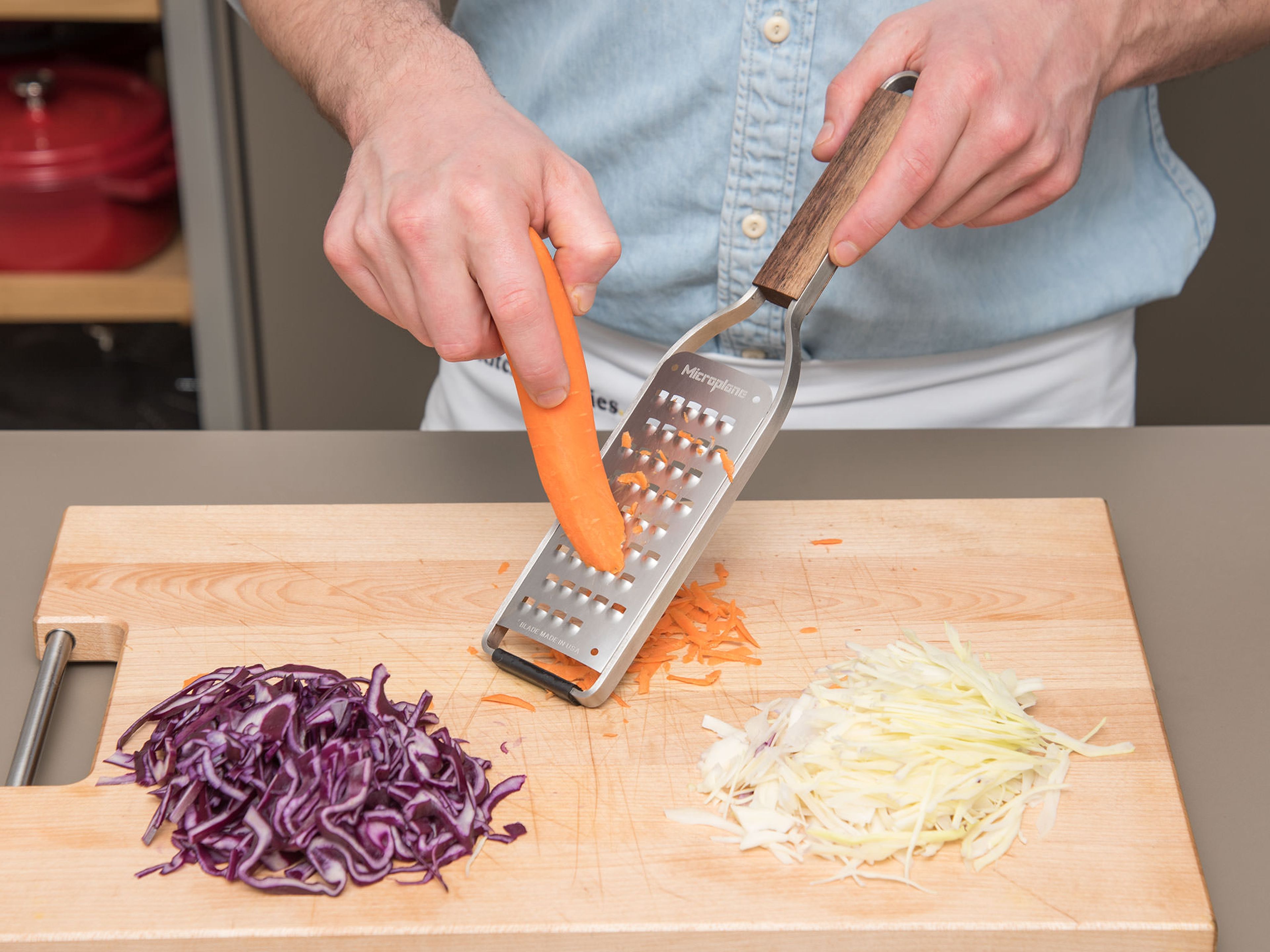 Finely slice red cabbage and white cabbage. Peel and roughly grate carrot. Transfer cut vegetables to a bowl and add olive oil, cider vinegar, and maple syrup. Toss to coat and season with salt and pepper to taste. Set coleslaw aside.