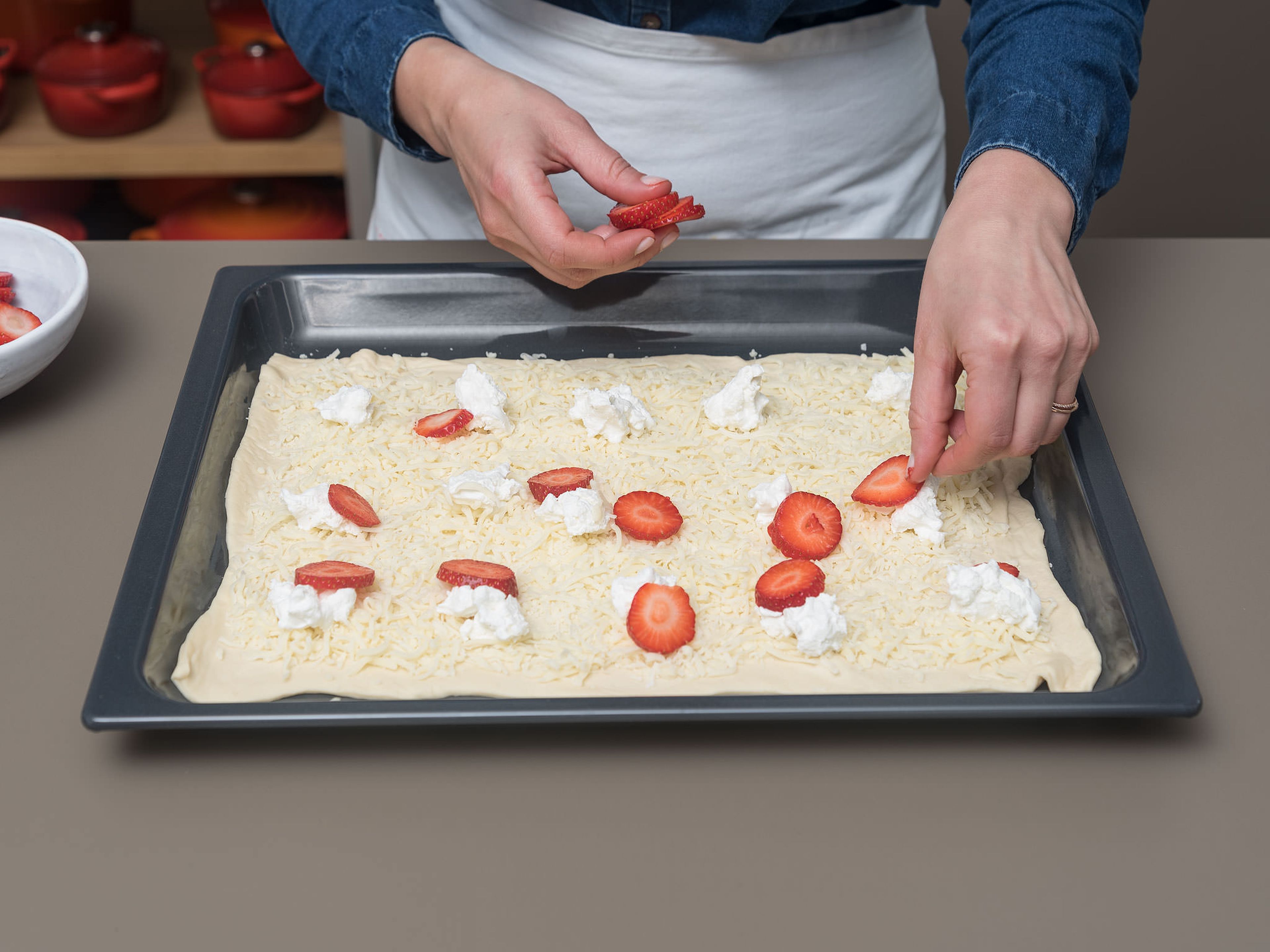 Roll pizza dough out onto a parchment-lined baking sheet. Top with shredded mozzarella, large crumbles of goat cheese, and strawberry rounds. Bake at 190°C/375°F for approx. 20 – 30 min., or until the cheese is bubbling and the crust is golden-brown.