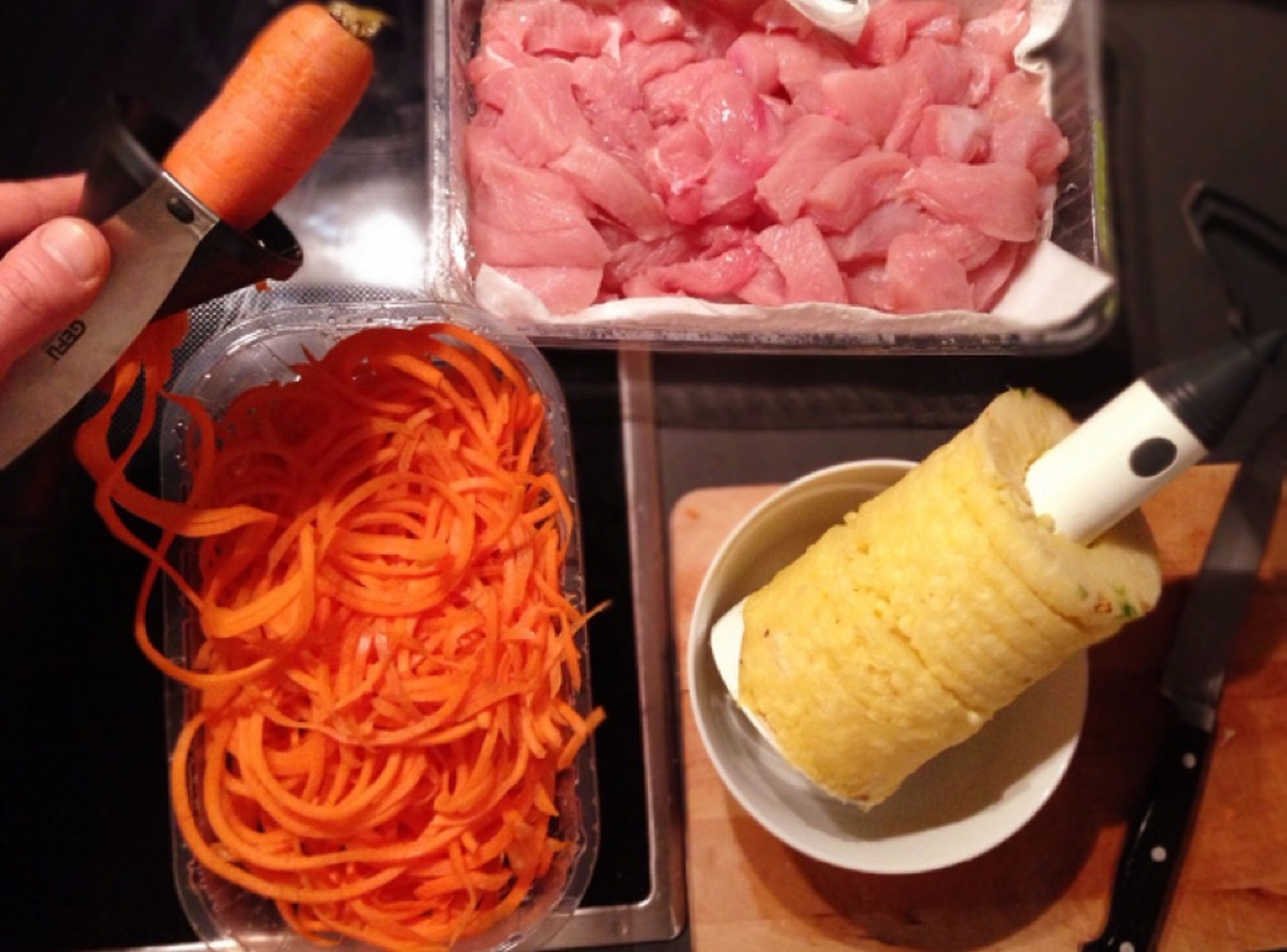 Pat turkey breast dry with paper towels, then cut into strips or small chunks. Slice carrots or use a spiralizer to make carrot spaghetti. Set some sliced carrot aside for serving. Cut pineapple into bite-sized pieces and finely chop garlic and ginger.