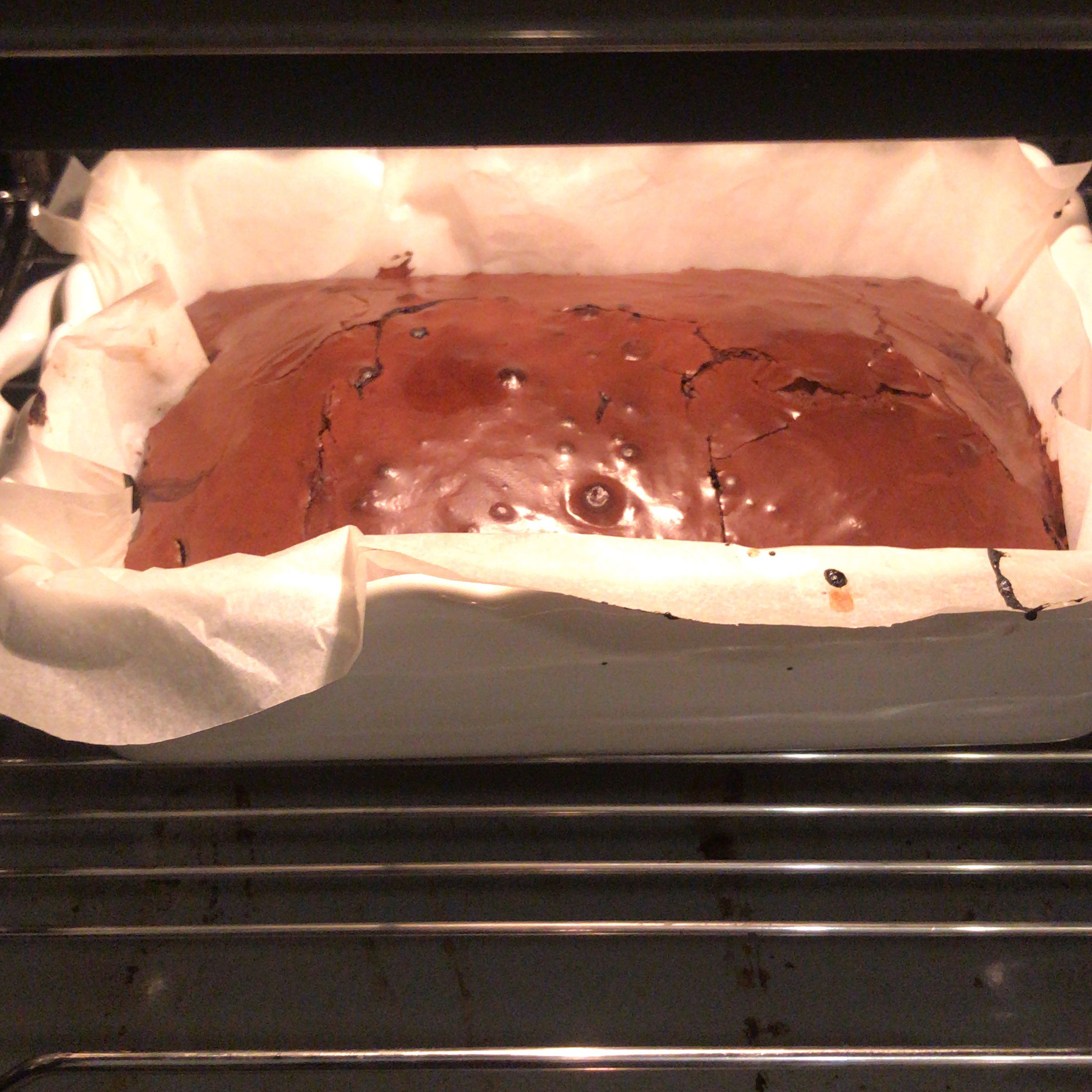 After cherries, other half of the chocolate mixture can put over the cherries. And the cake is ready to bake in 180c 1 hour
