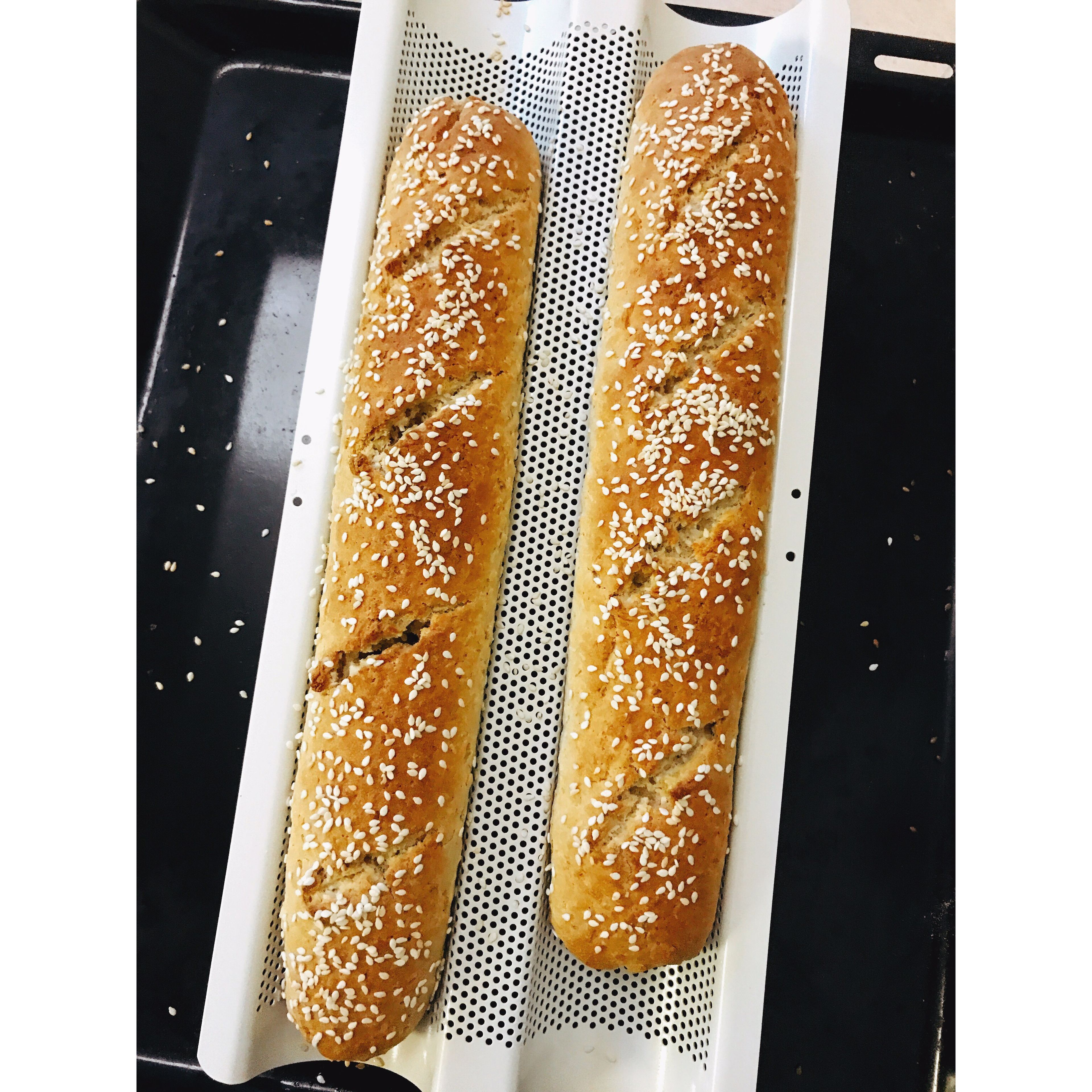 Brown coconut baguette with sesame