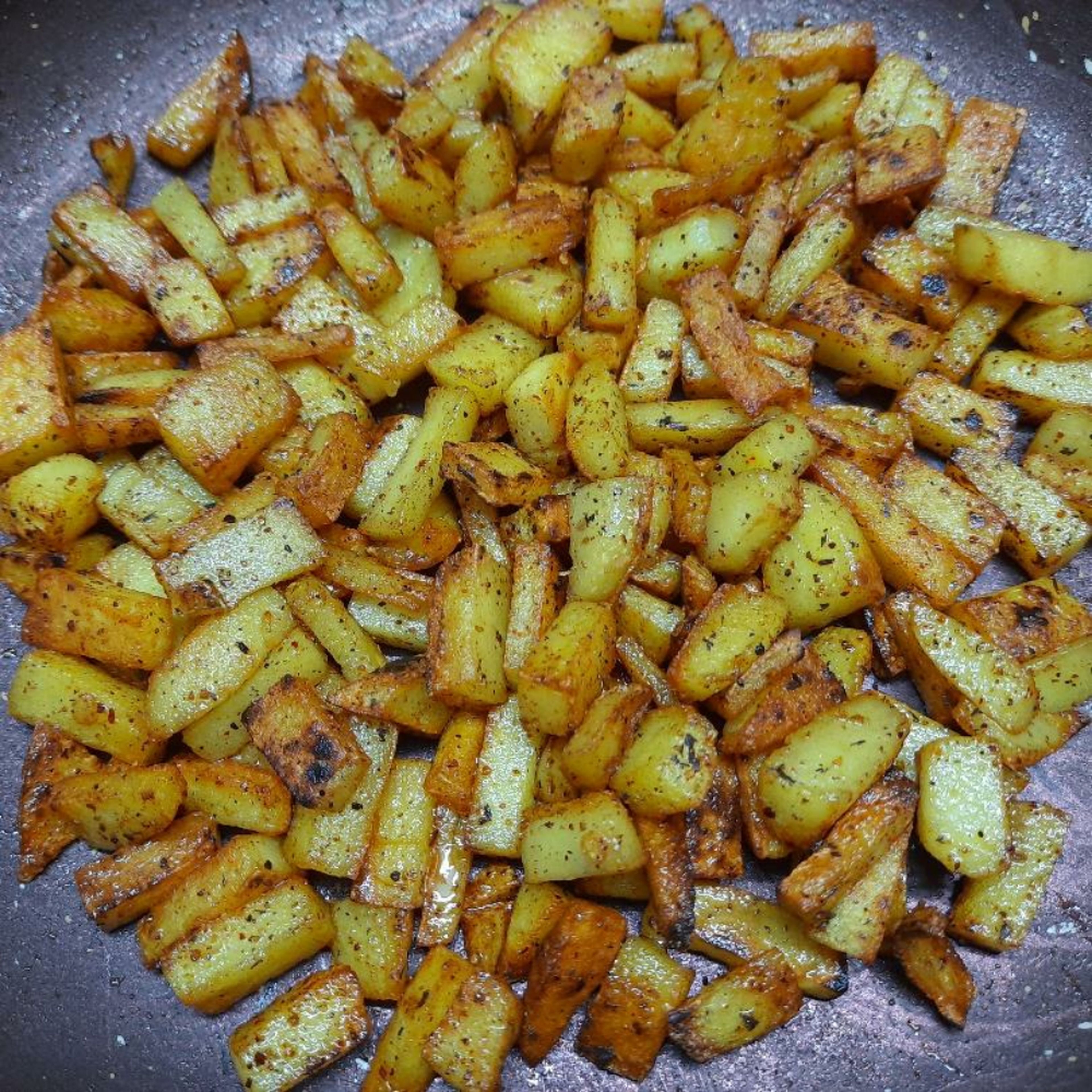 Potatoes should turn brown. They will become slightly crispy. Try to fry all sides evenly. Don't char the pieces. Immediately turn off flame if you see fumes coming out of pan. Your curry is ready! Serve hot.
