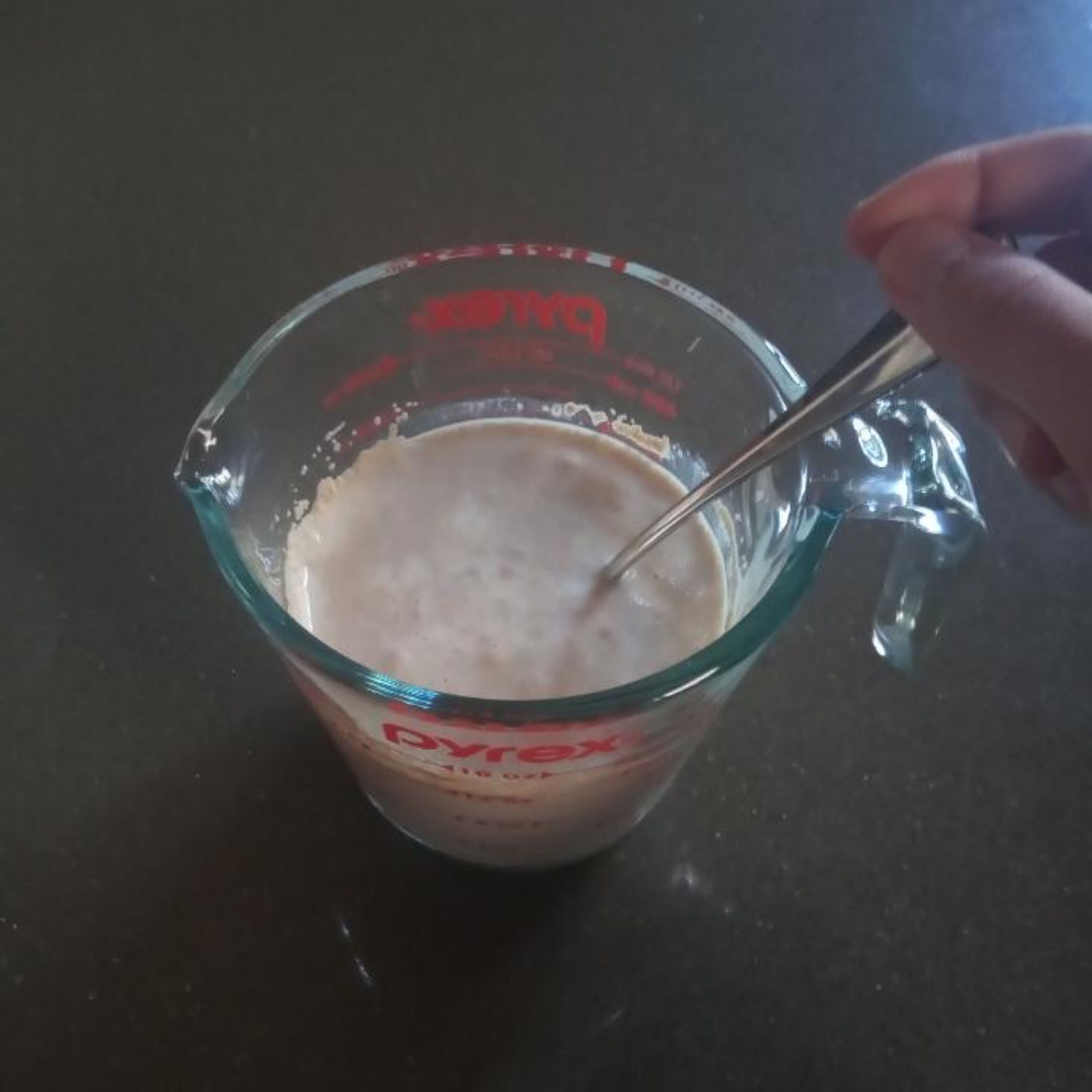 Using a fork, whisk milk, yeast and sugar in a jug.