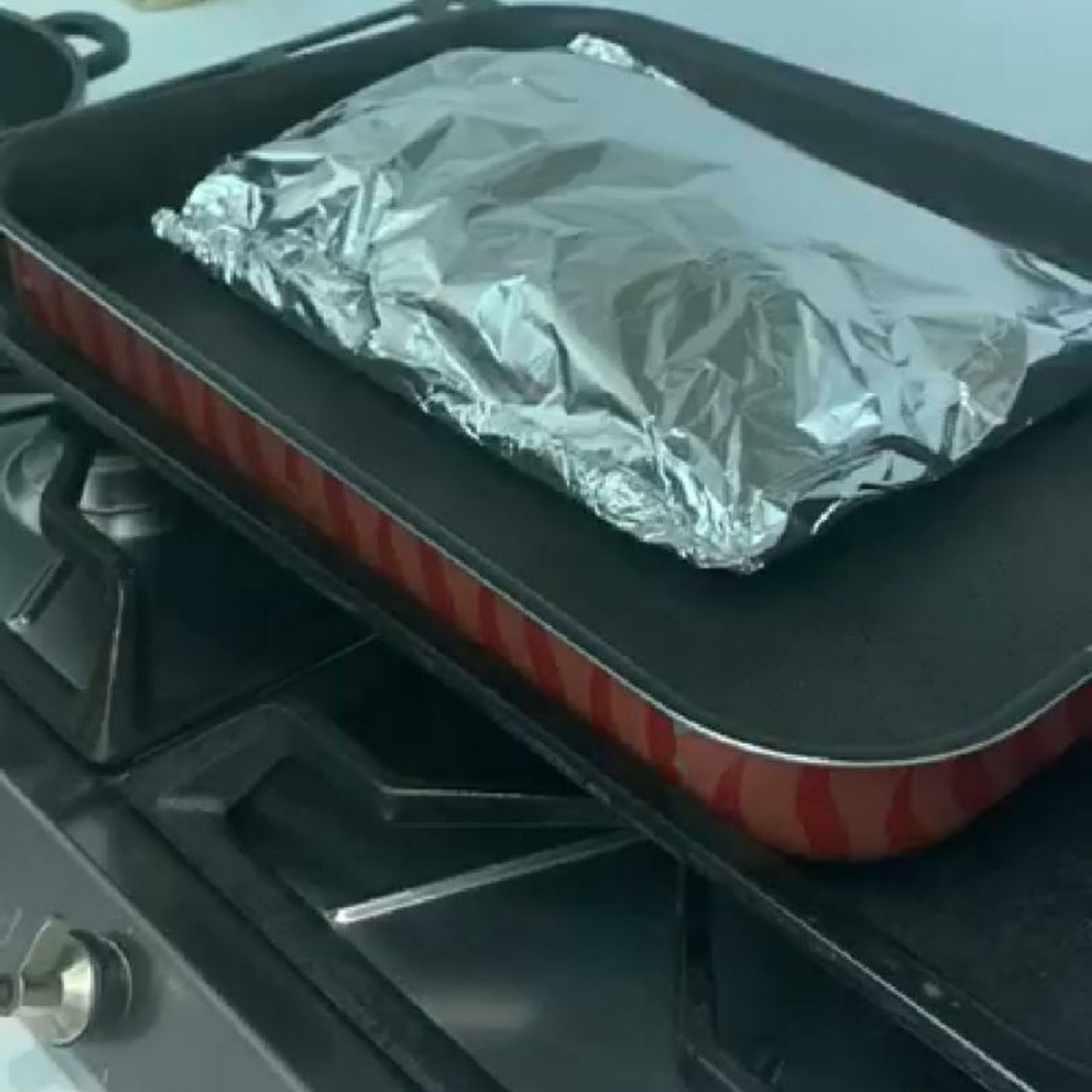 cover the steak well inside the baking sheet and staple the sheet around to seal it then cover with aluminum foil. Bakeiin the over on 150 deg c for 45 mins.
