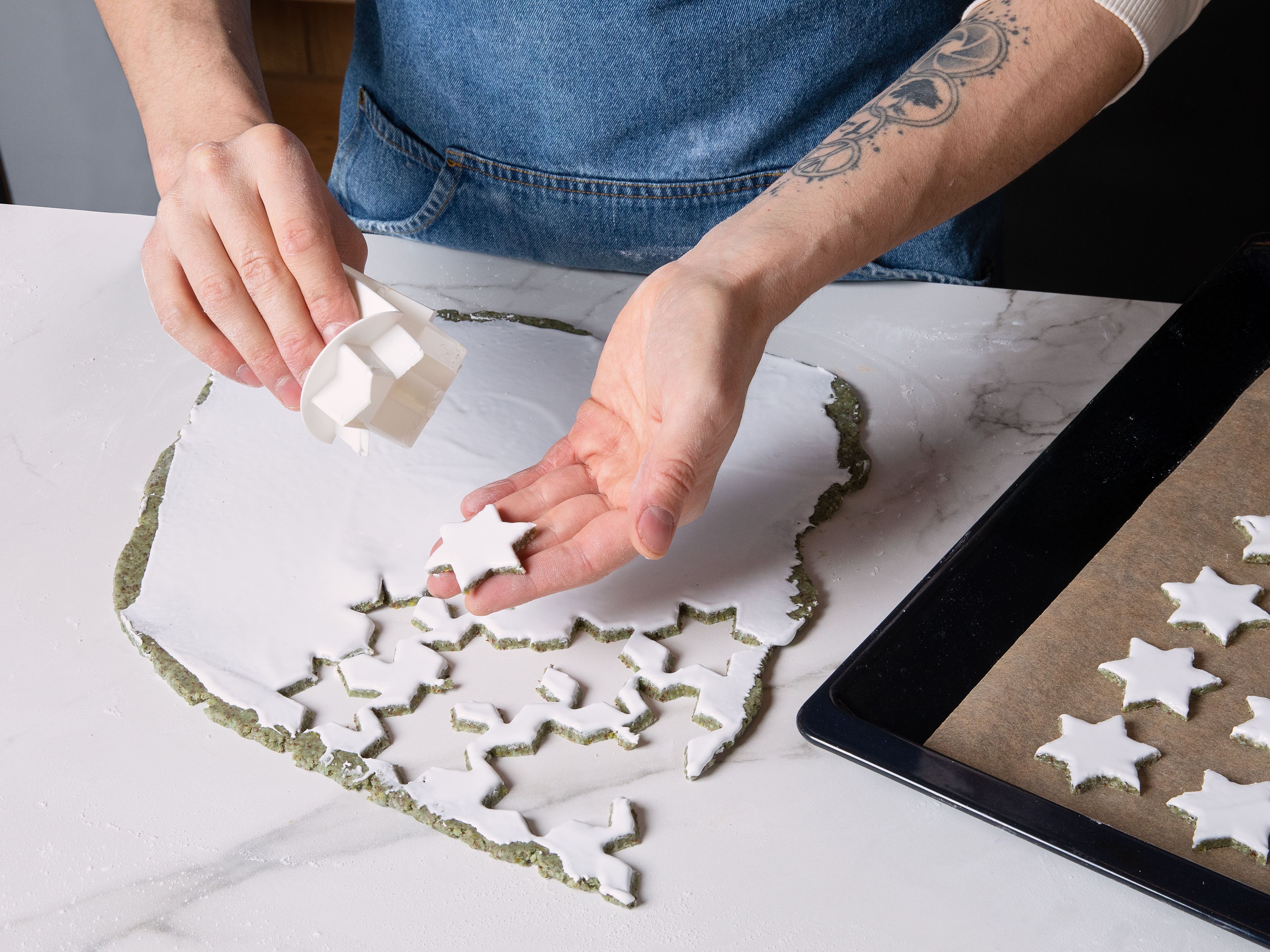 Dust work surface with little wheat flour, roll out dough approx. 5 mm/0.2 in. thick. For the meringue, beat powdered sugar with egg white until stiff in a bowl. Carefully spread on the dough, and cut cookies out with a star shaped cookie cutter. Place cut out stars on baking sheet lined with parchment paper. Bake for approx. 25 min., and let cool completely. Serve immediately or store in an airtight container if you're serving later.