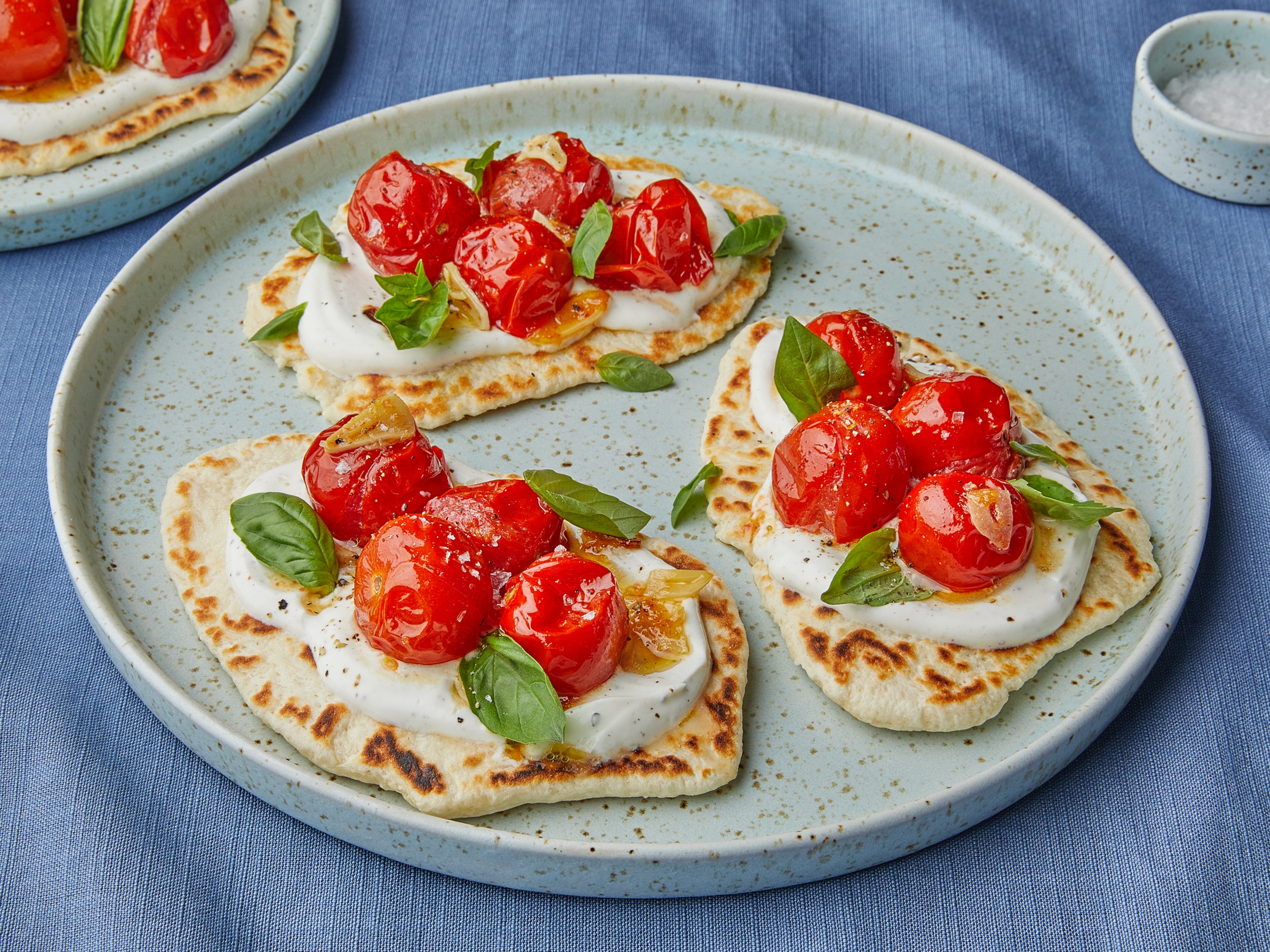 Easy homemade flatbreads with burst cherry tomatoes
