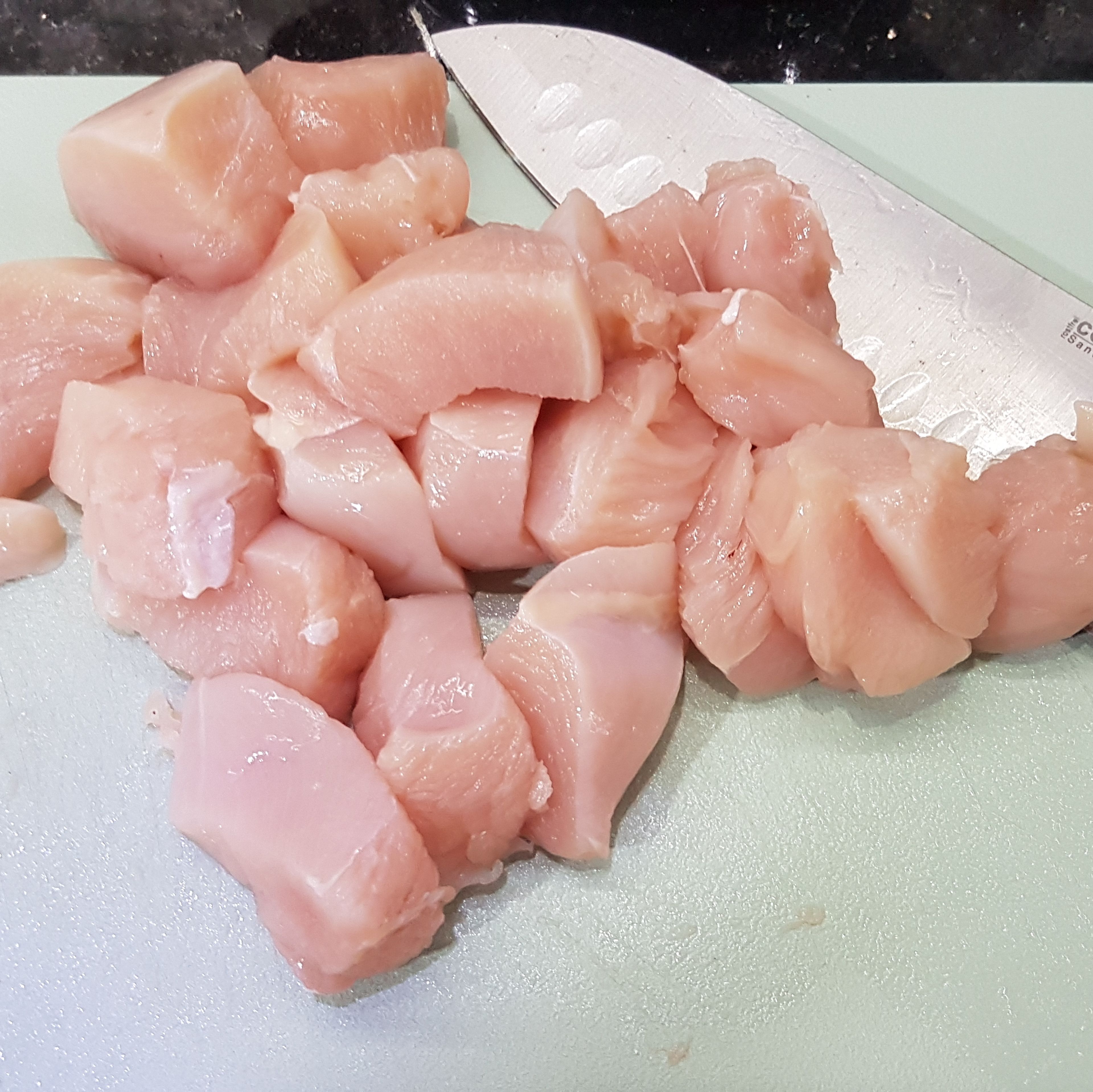 Cut the chicken breasts into cubes and add to the pot. Cook until tender.