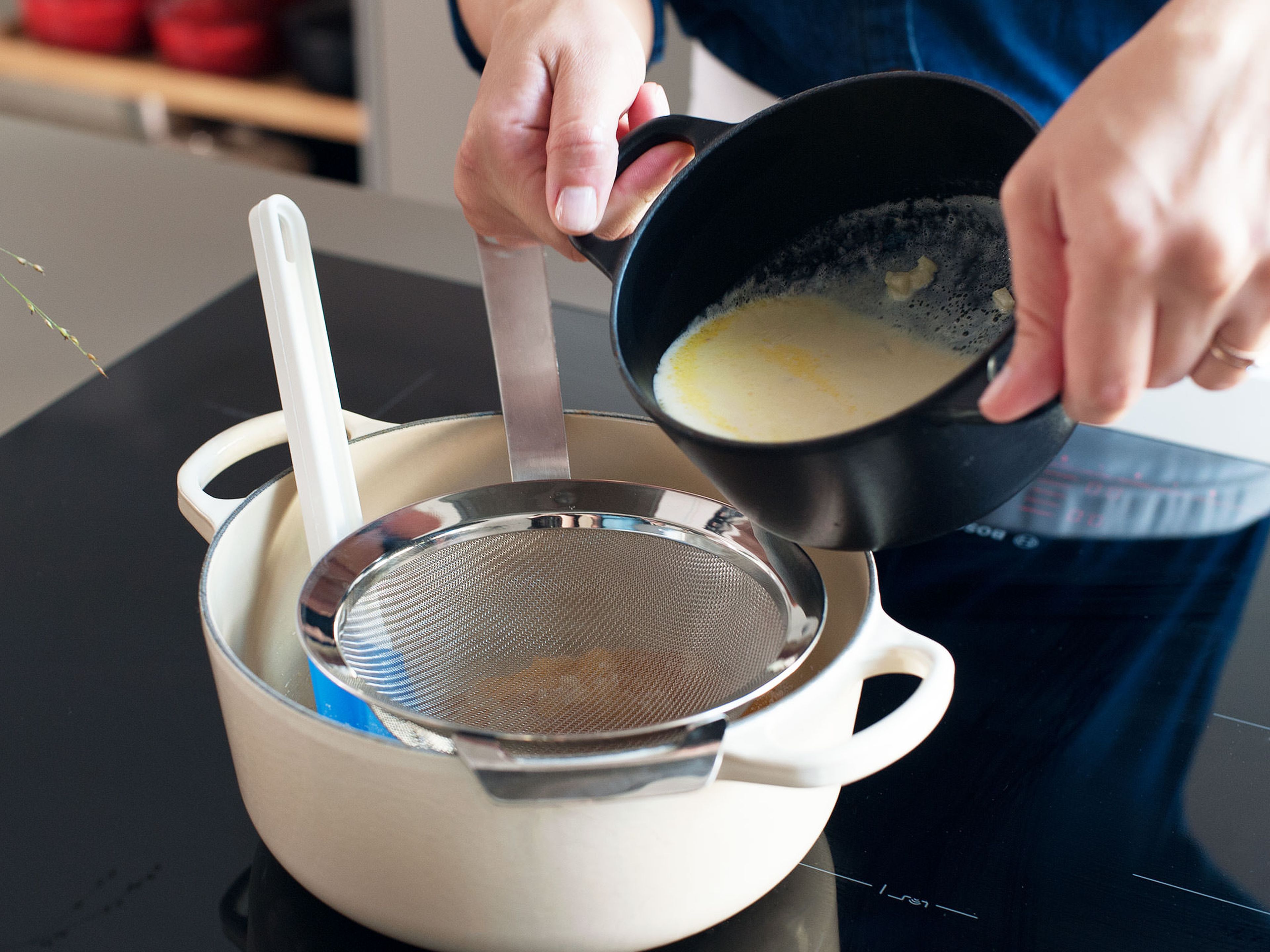 In a medium saucepan, slowly warm heavy cream until it just comes to a boil. Remove from heat and add chopped ginger; cover and let steep for 30 minutes. Strain cream to remove ginger.