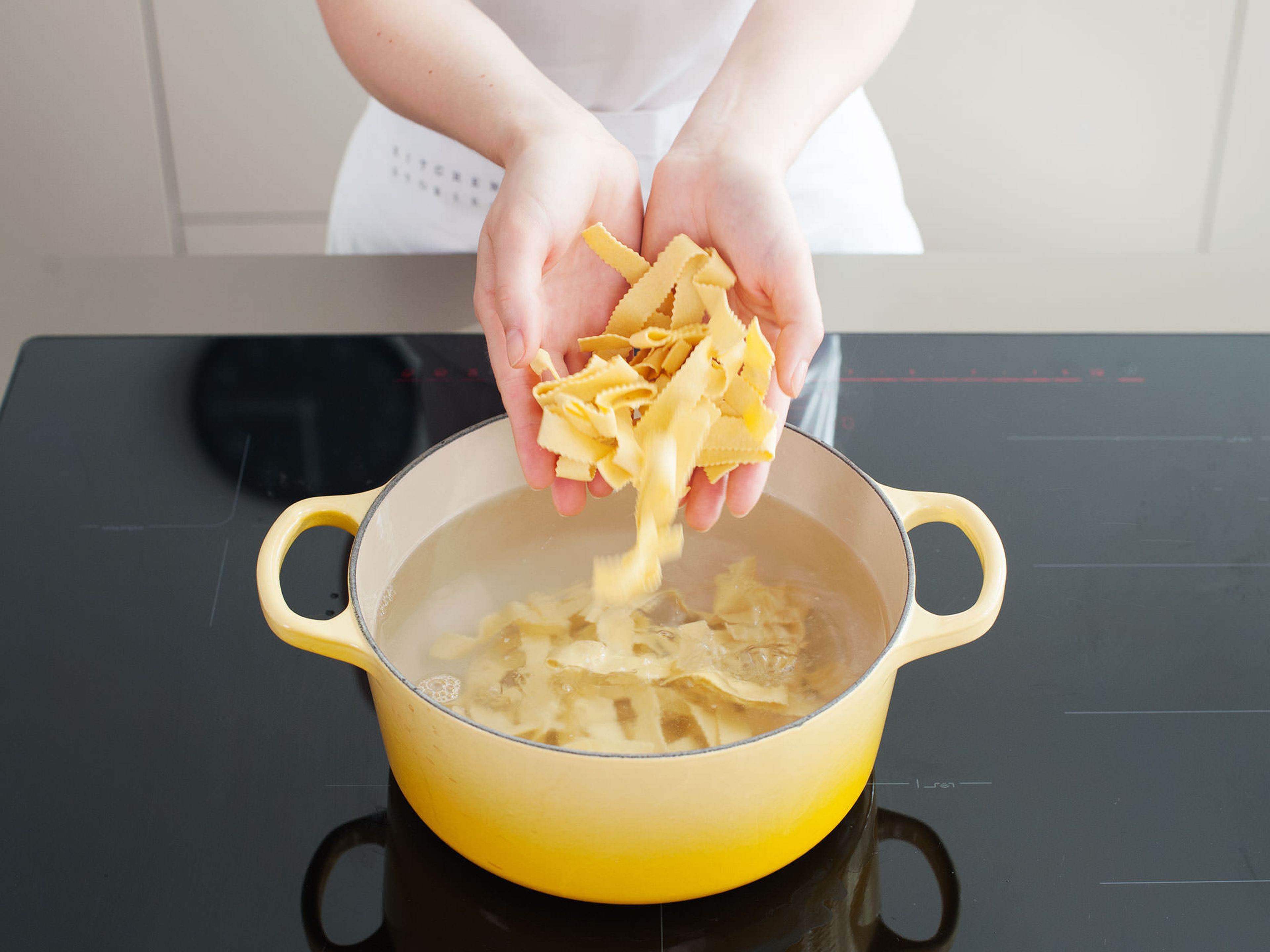 When almost ready to serve, boil pasta, according to package instructions, in salted water. If sauce is too thin, remove lid and turn slow cooker to high; sift in a little bit of flour, a tablespoon at a time, and stir to combine until thickened. Serve stew over tagliatelle and enjoy!