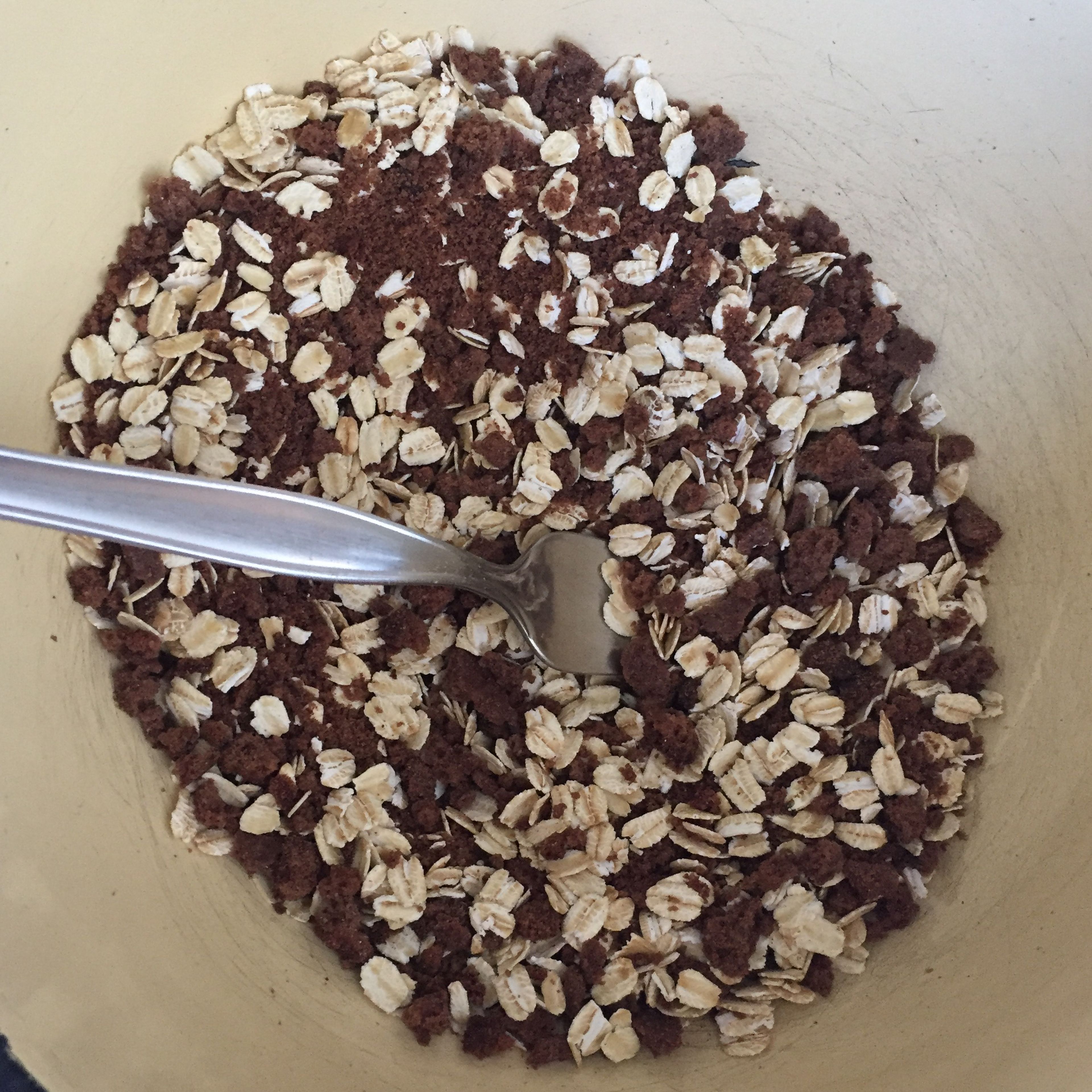 Once the brownies are crumbled, add the half cup of oats to the bowl, and stir to combine.