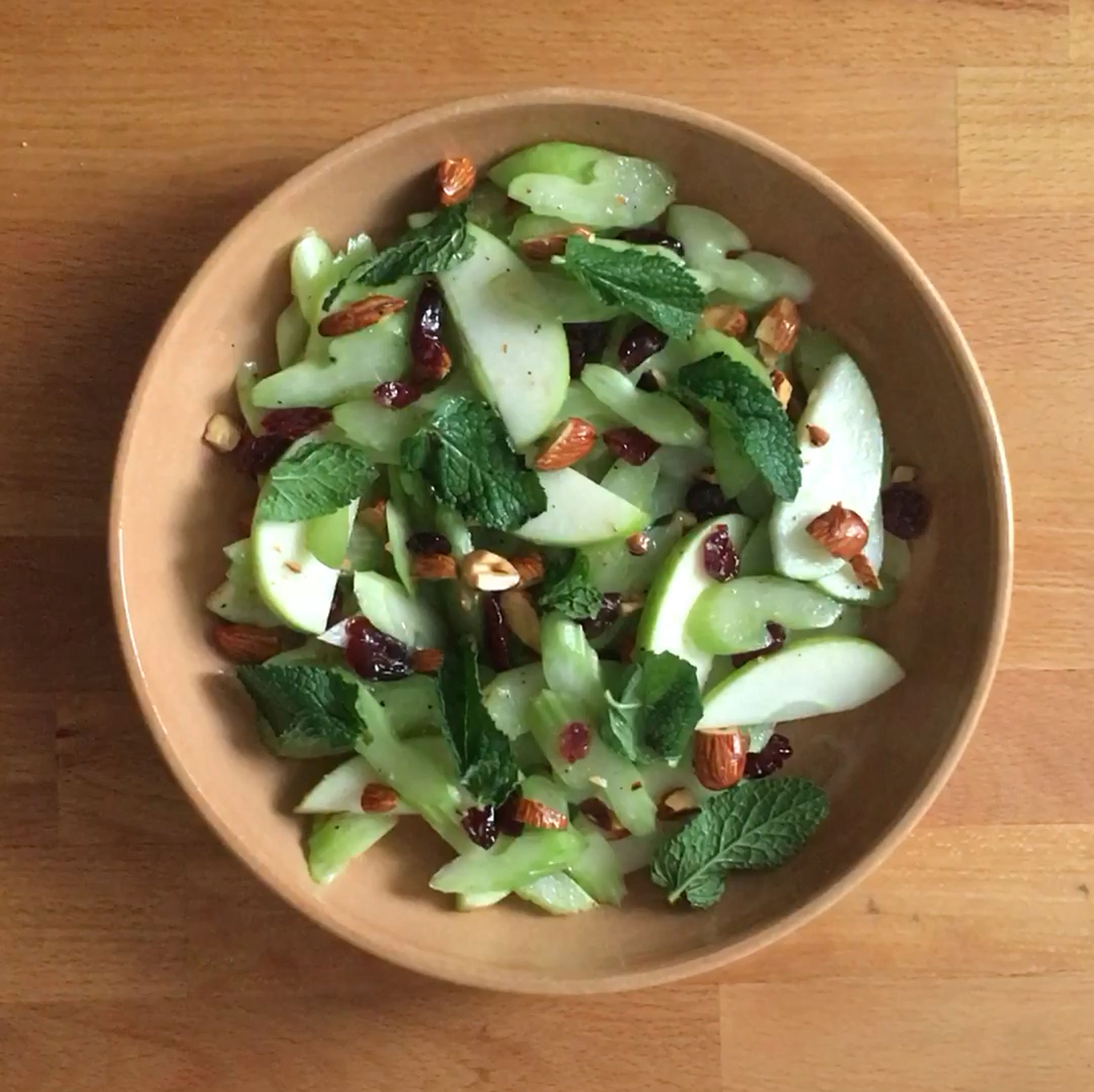 Transfer the salad to a serving platter if desired, it can also be served directly in the bowl you mixed it in. Top with mint and celery leaves (if you had them). Serve immediately or keep in the fridge until serving. Enjoy!