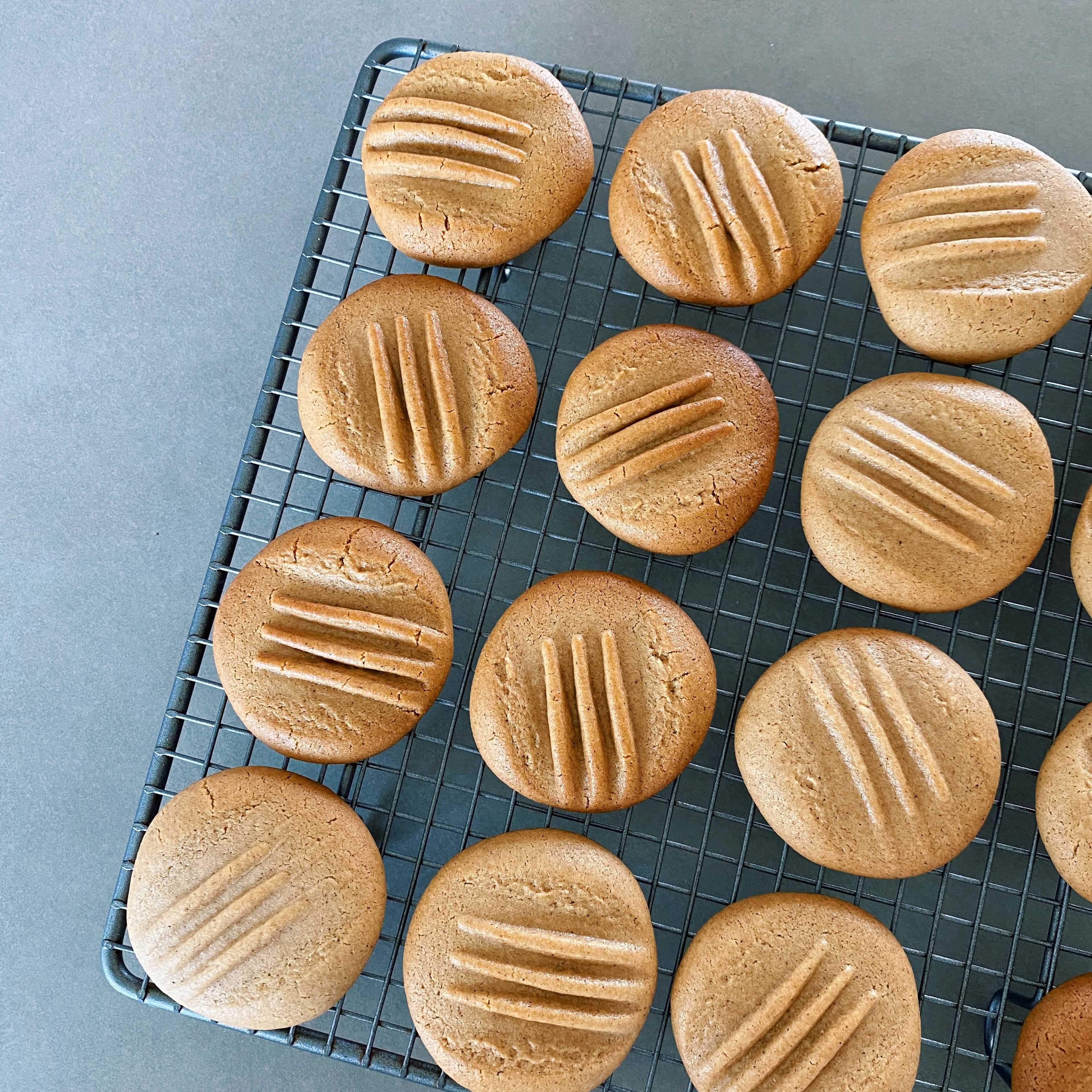 Bake for approximately eight minutes or until biscuits are a deep golden colour, but not burnt. Remove from oven and transfer biscuits to a wire rack after one minute. Allow to cool.