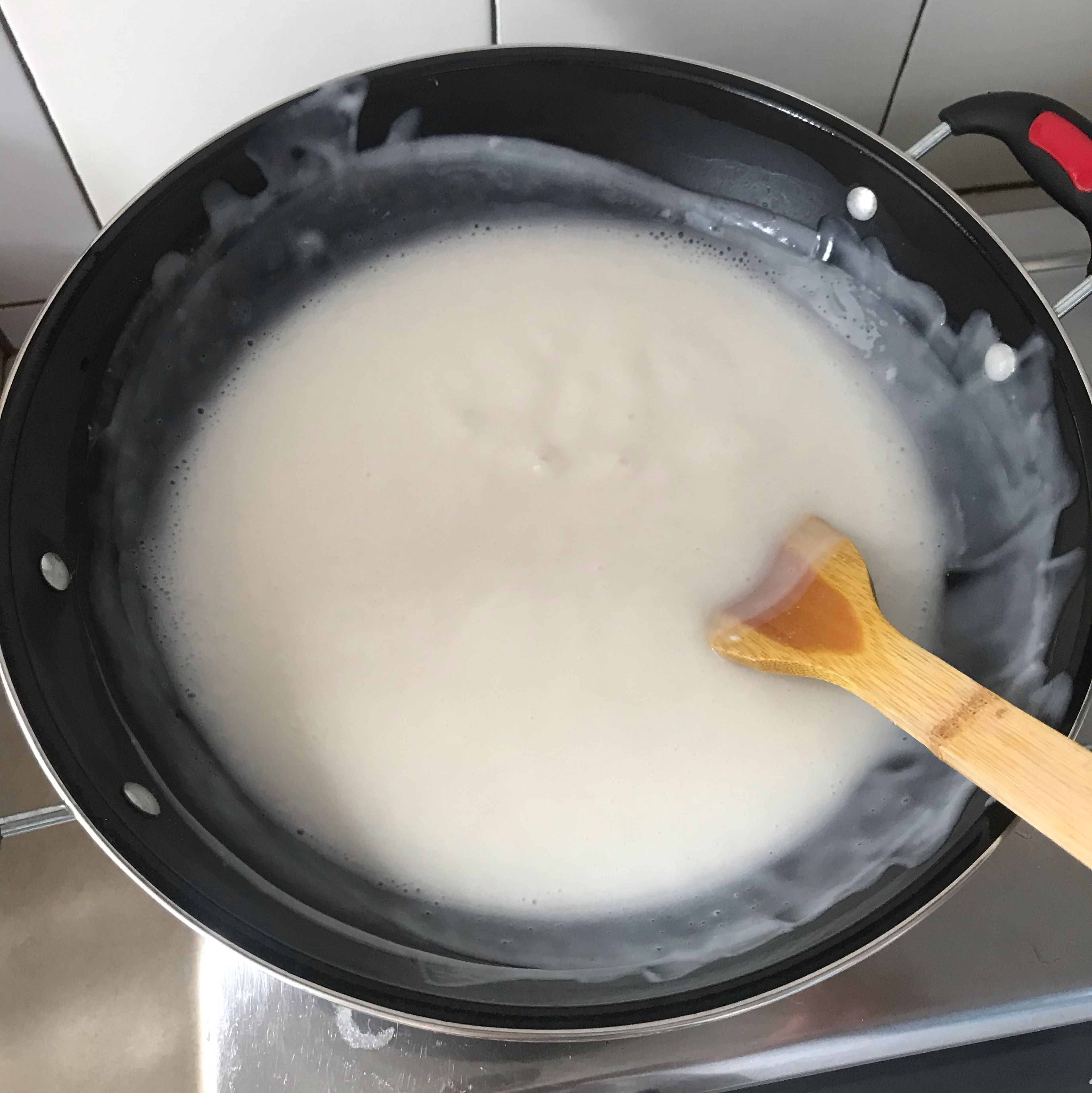 put water, coconut milk and sugar on the wok and heat it up while stirring it. make sure the mixture becomes soupy