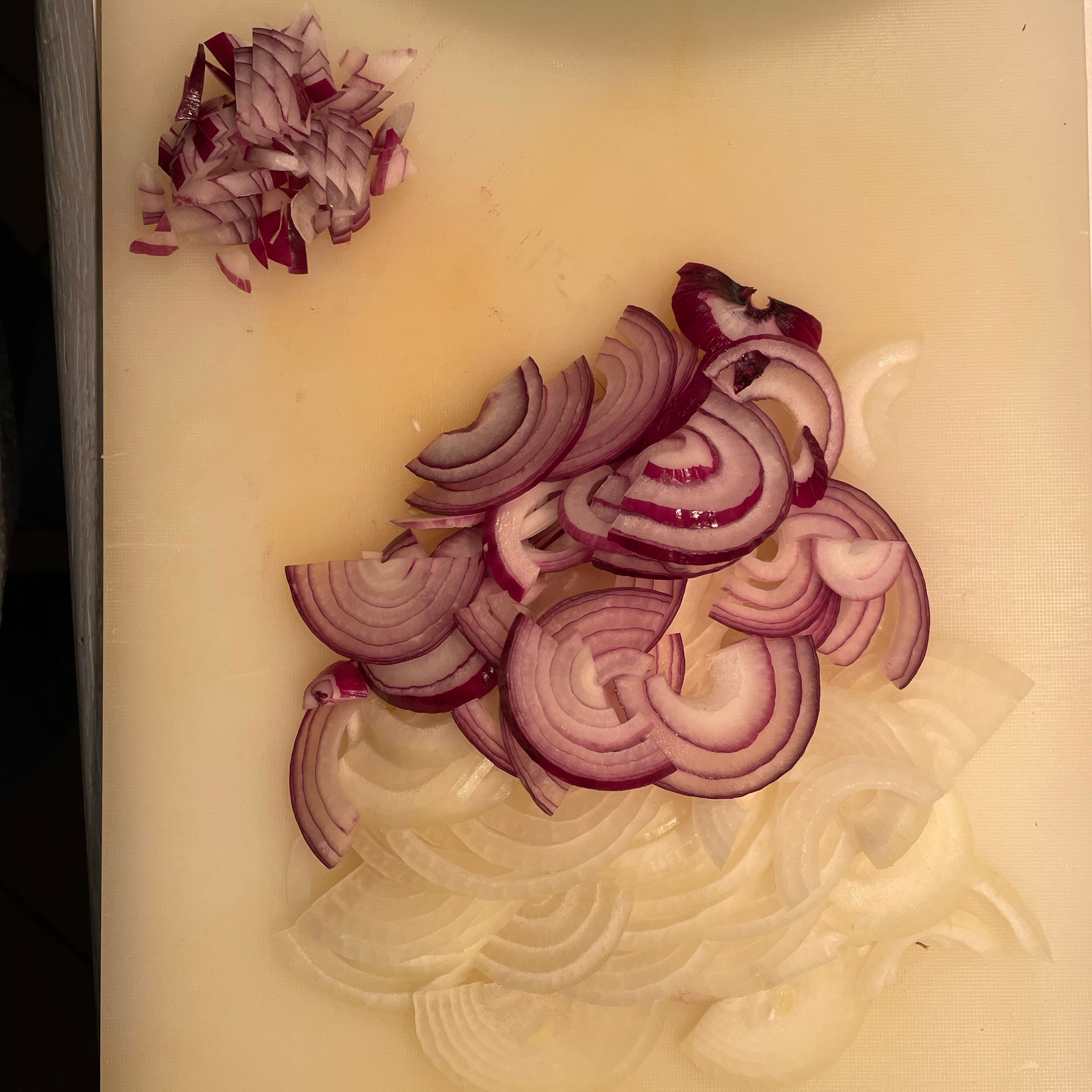 Slice onions and set aside about a quarter of the red onion for grinding that will yield 1tbsp of ground red onion. Dice the onion reserved for grinding.