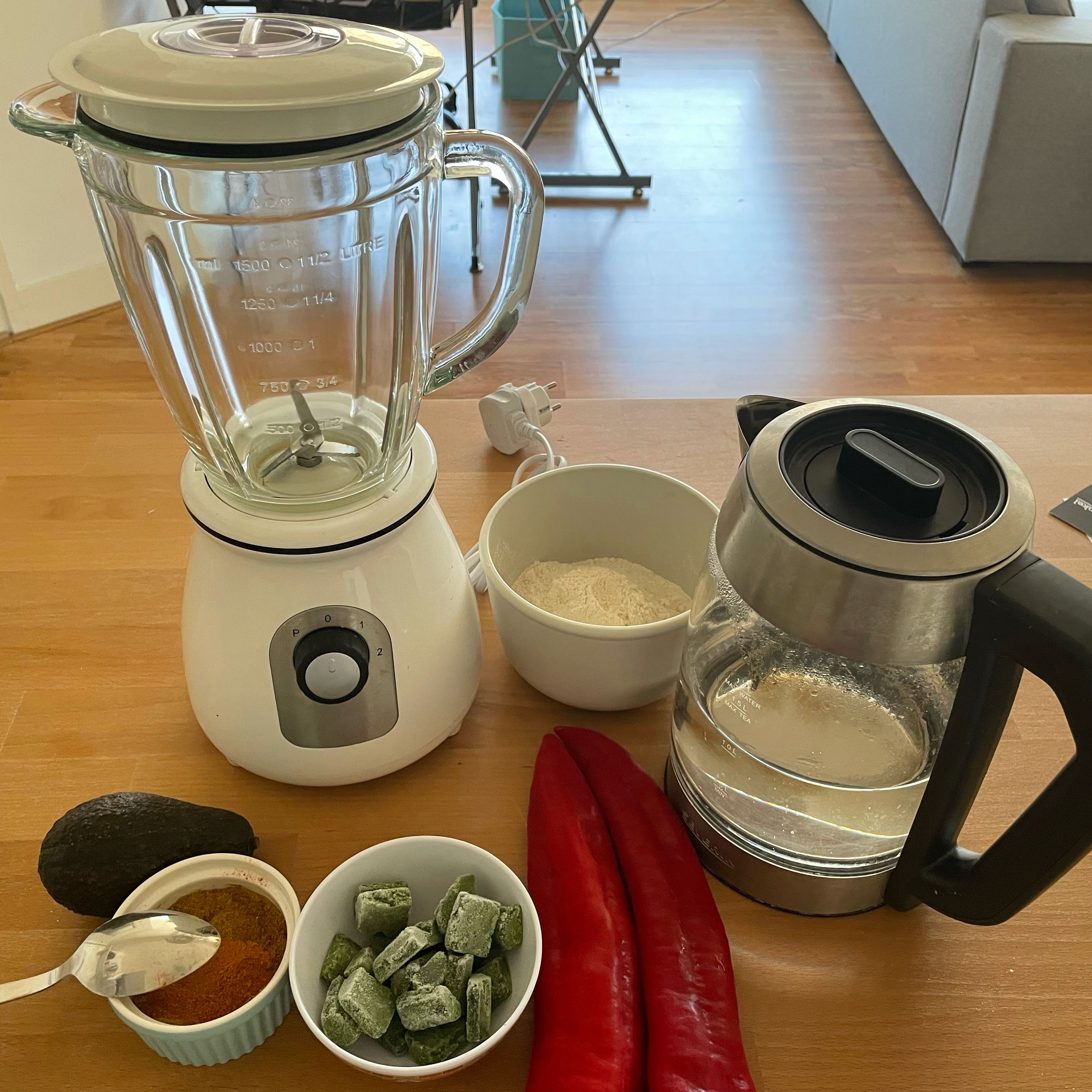 Blend the peppers avocado and onions first. Add the water to blend easily. Add the beans flour and blend till a smooth paste is achieved. Add your preferred seasoning for flavor. You can also add chopped spinach.