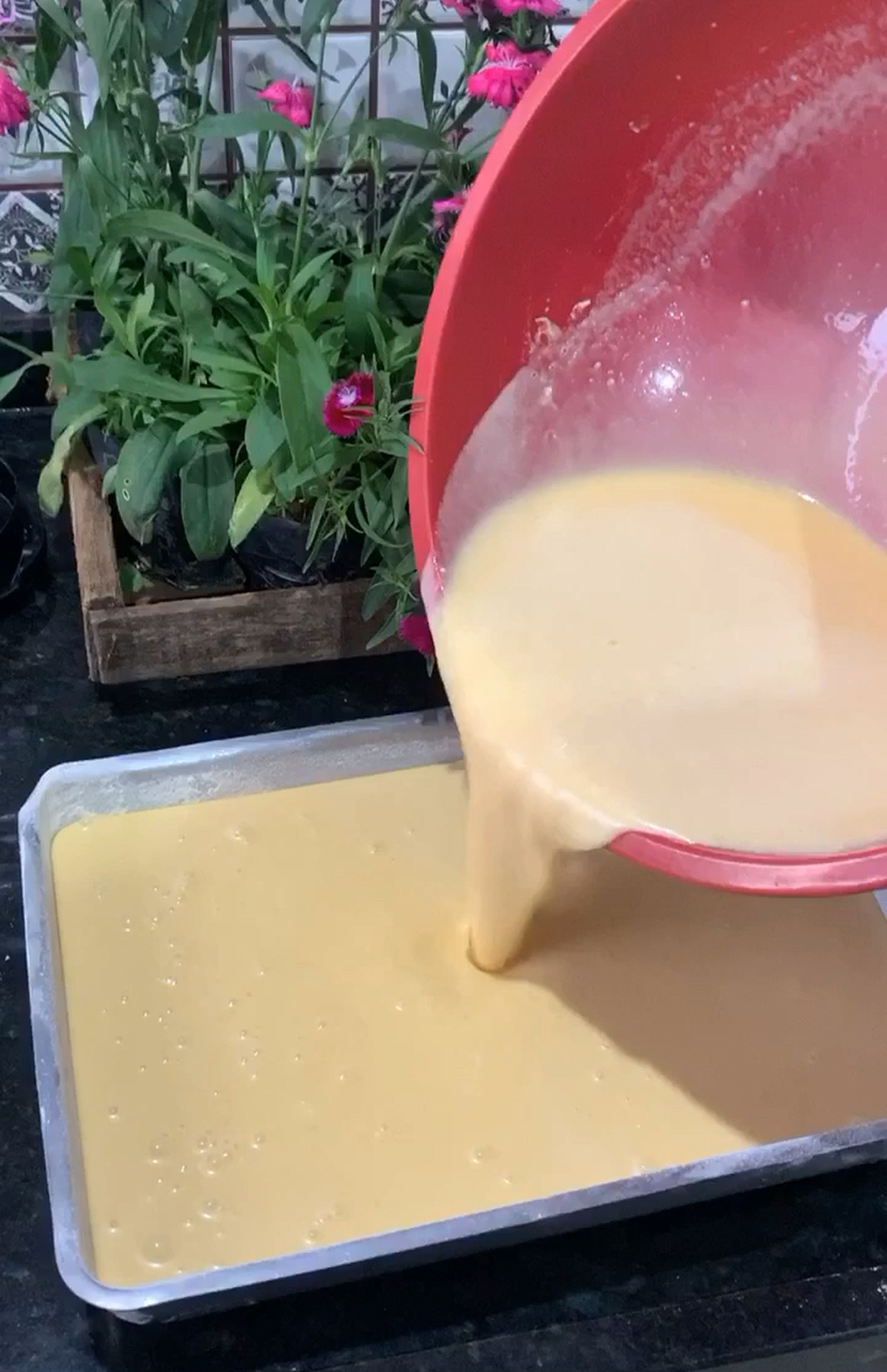 Pour the batter into the prepared cake pan! At least 2 inches high (important: this is the secret for the creamiest cake)!