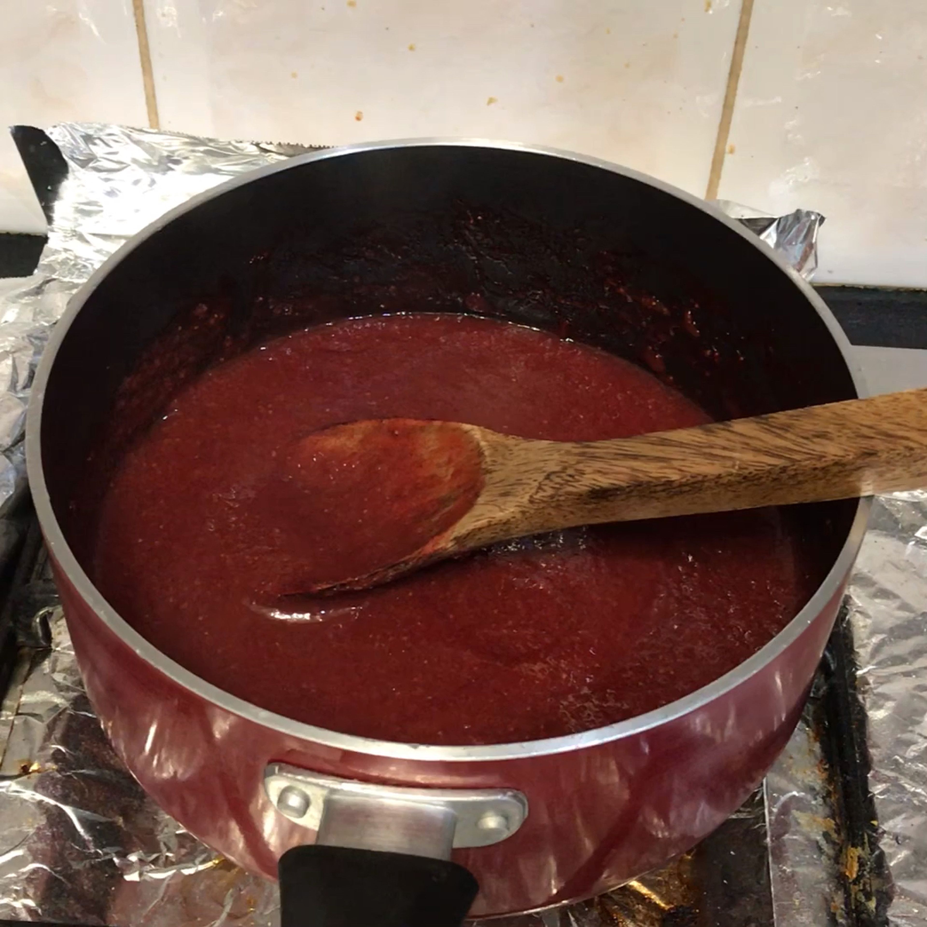 Once bubbling, reduce heat to medium-low and slowly reduce until berries begin to break up, and the mixture has reduced by half. This will take about 20 minutes. Occasionally stir the mixture to prevent burning. If your mixture has reduced by half and is still watery, continue to cook until all of the liquid is out.