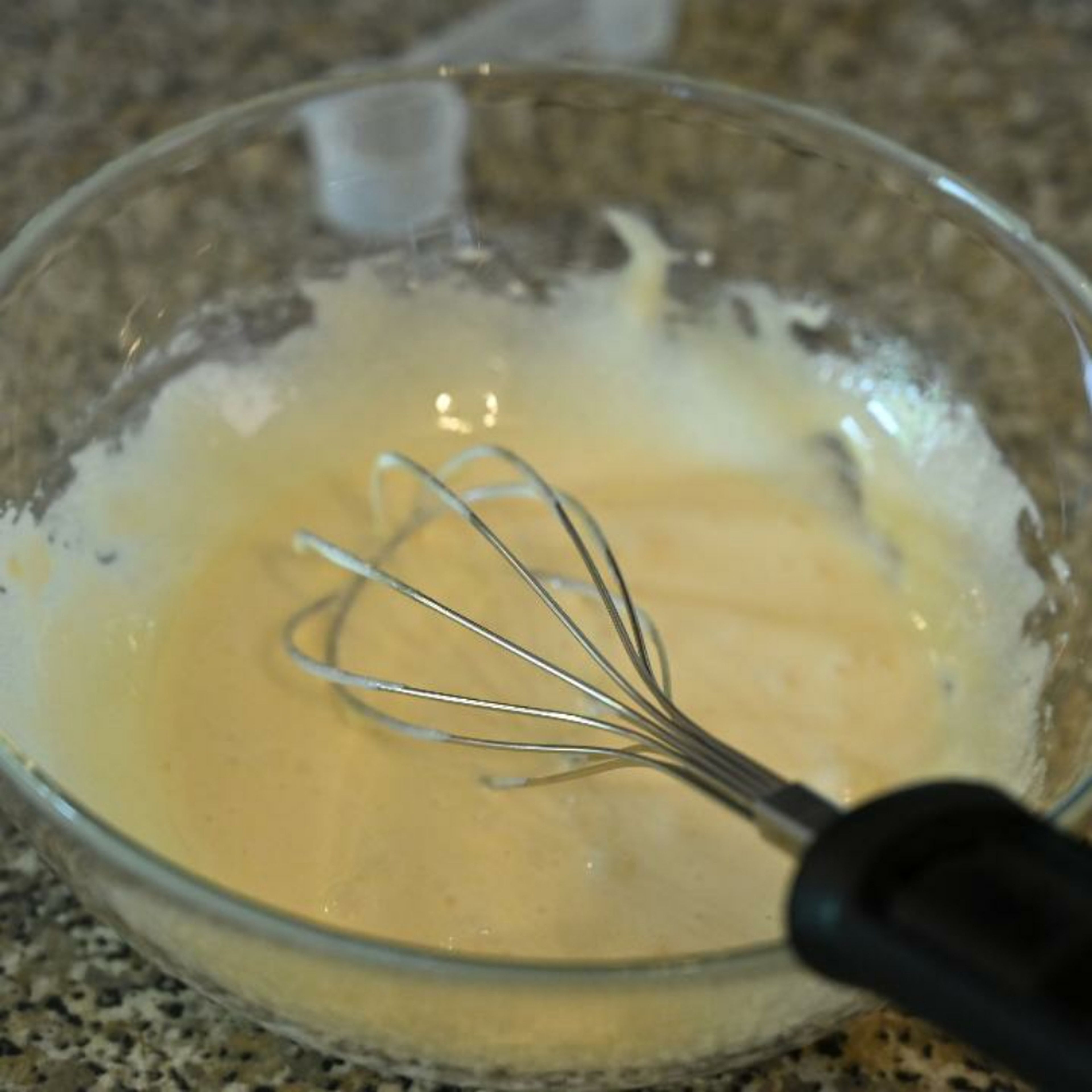In a large whisk together the egg yolks and sugar, until thick and creamy.
